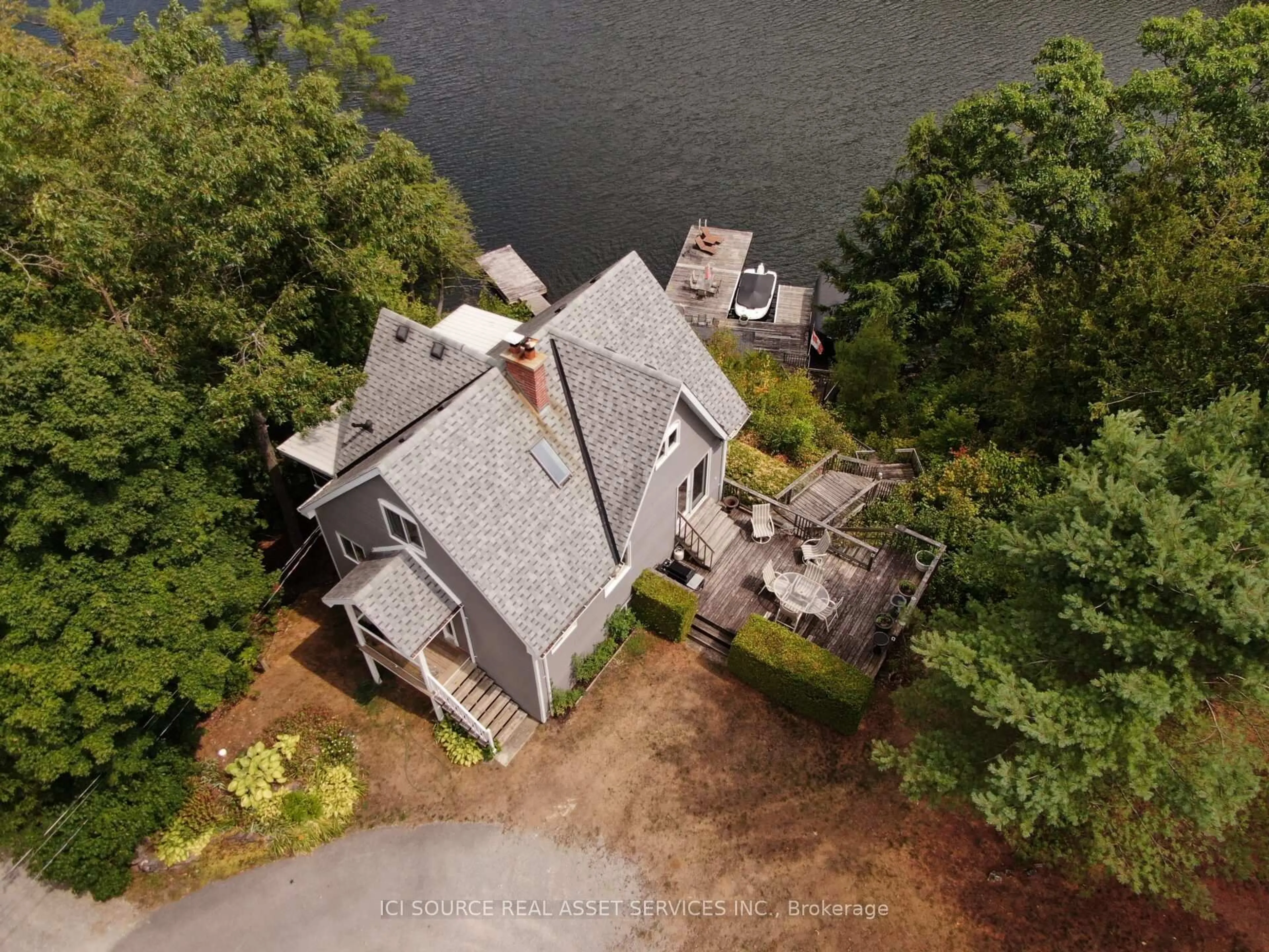 A pic from outside/outdoor area/front of a property/back of a property/a pic from drone, water/lake/river/ocean view for 1096 Lois Lane, Minden Hills Ontario K0M 2L1