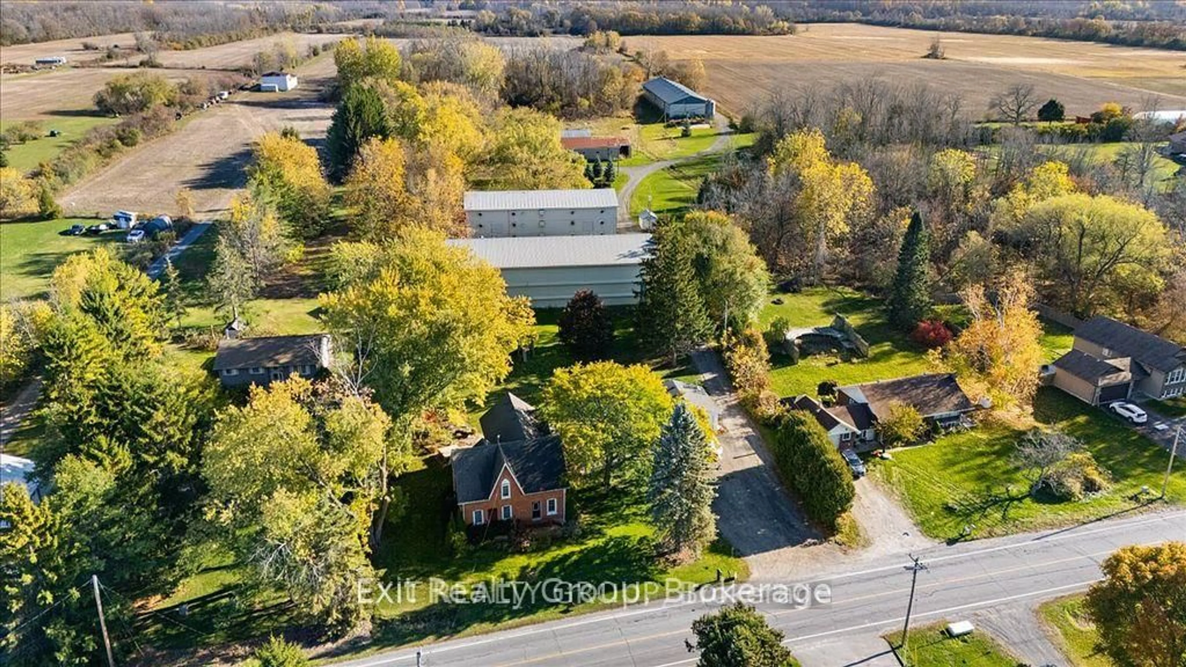 A pic from outside/outdoor area/front of a property/back of a property/a pic from drone, street for 2421 County Rd 3, Prince Edward County Ontario K0K 1L0