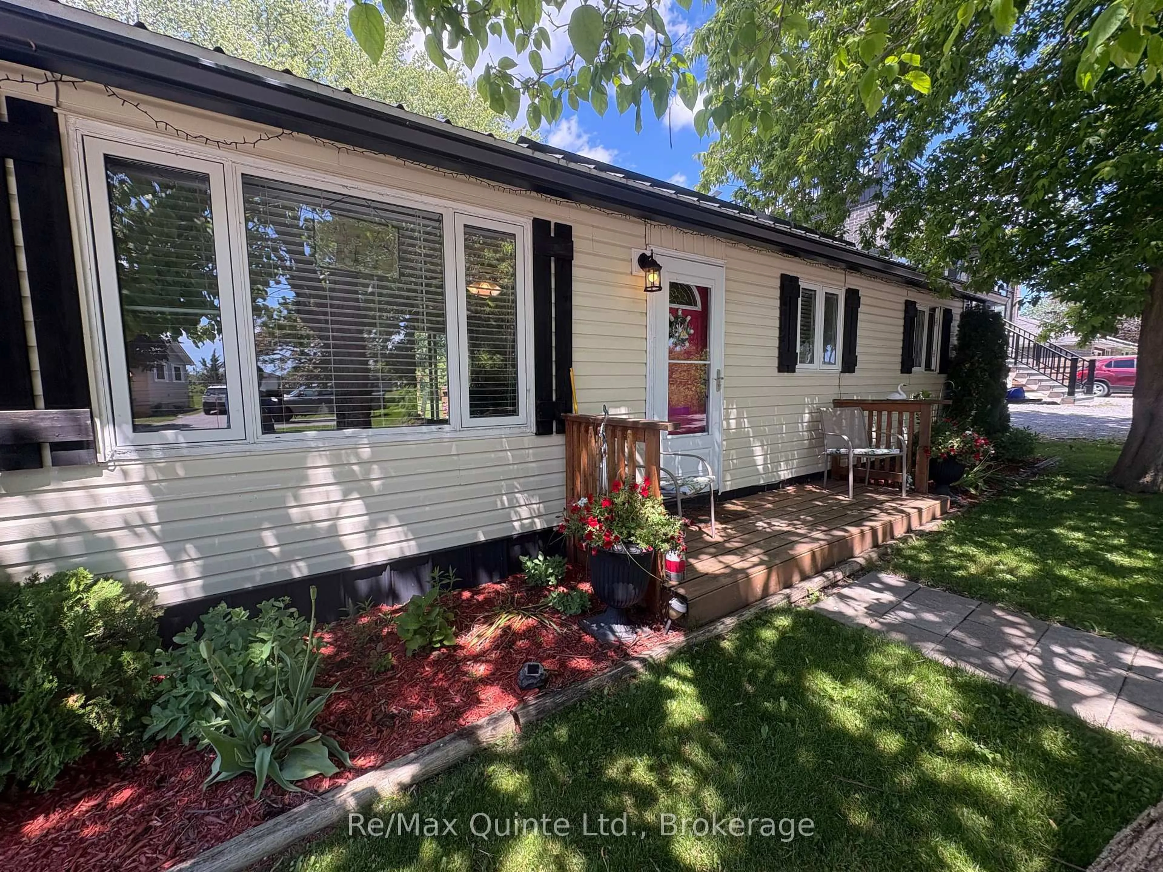 Home with vinyl exterior material, street for 14 Bay Ave, Prince Edward County Ontario K0K 1T0