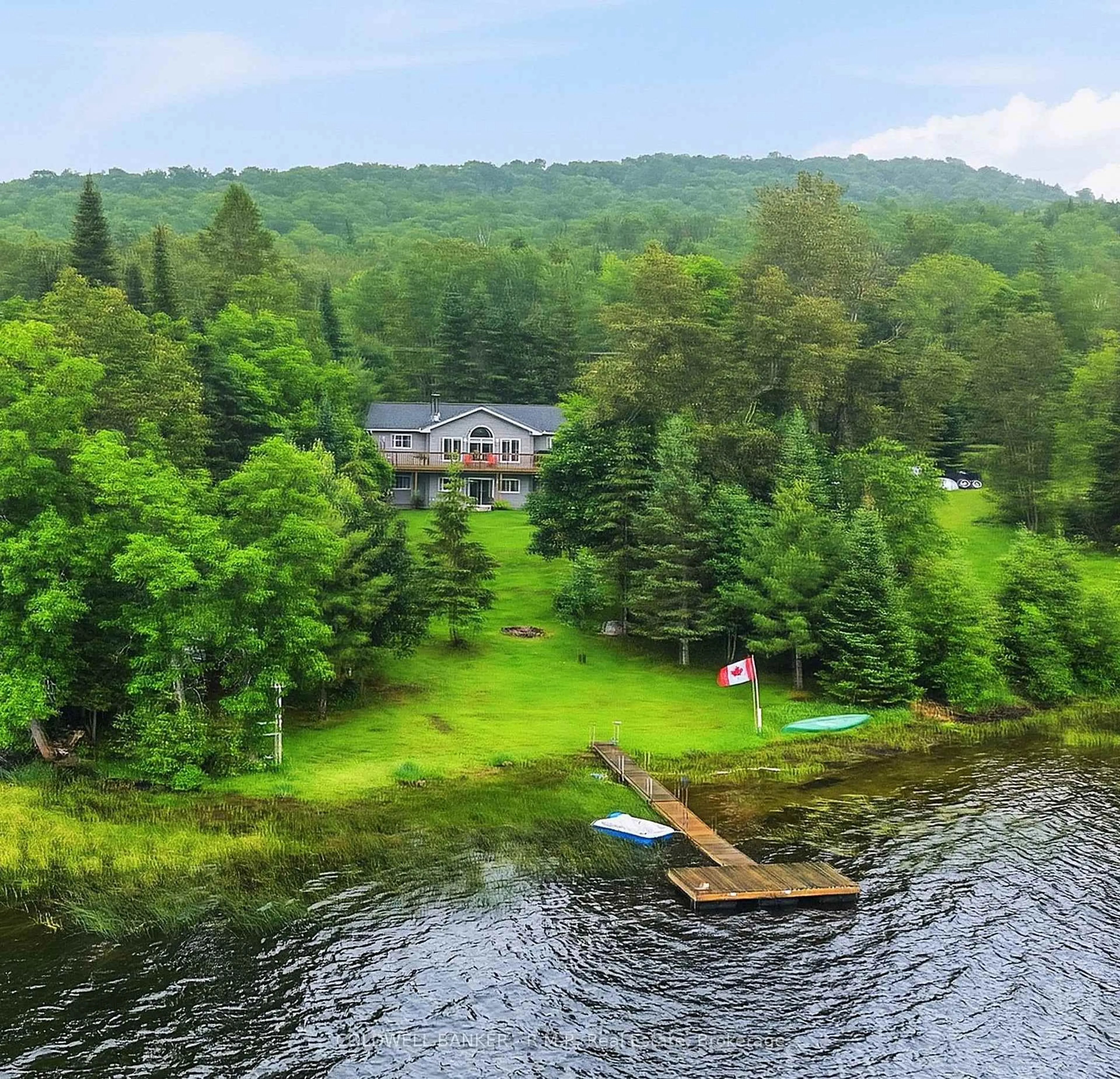 A pic from outside/outdoor area/front of a property/back of a property/a pic from drone, water/lake/river/ocean view for 1833 Eagle Lake Rd, Dysart et al Ontario K0M 1S0