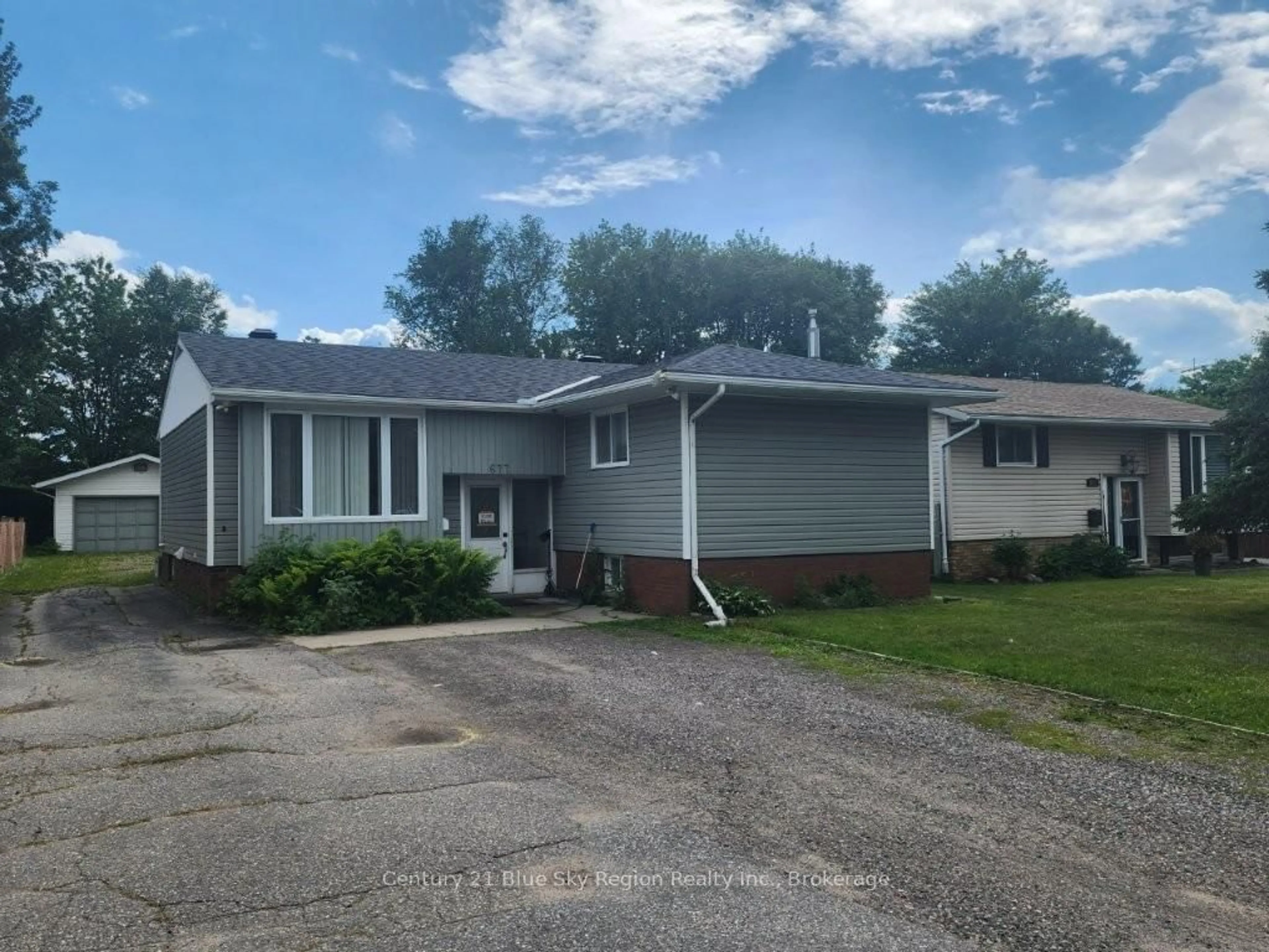 Home with vinyl exterior material, street for 677 Tackaberry Dr, North Bay Ontario P1B 8R1