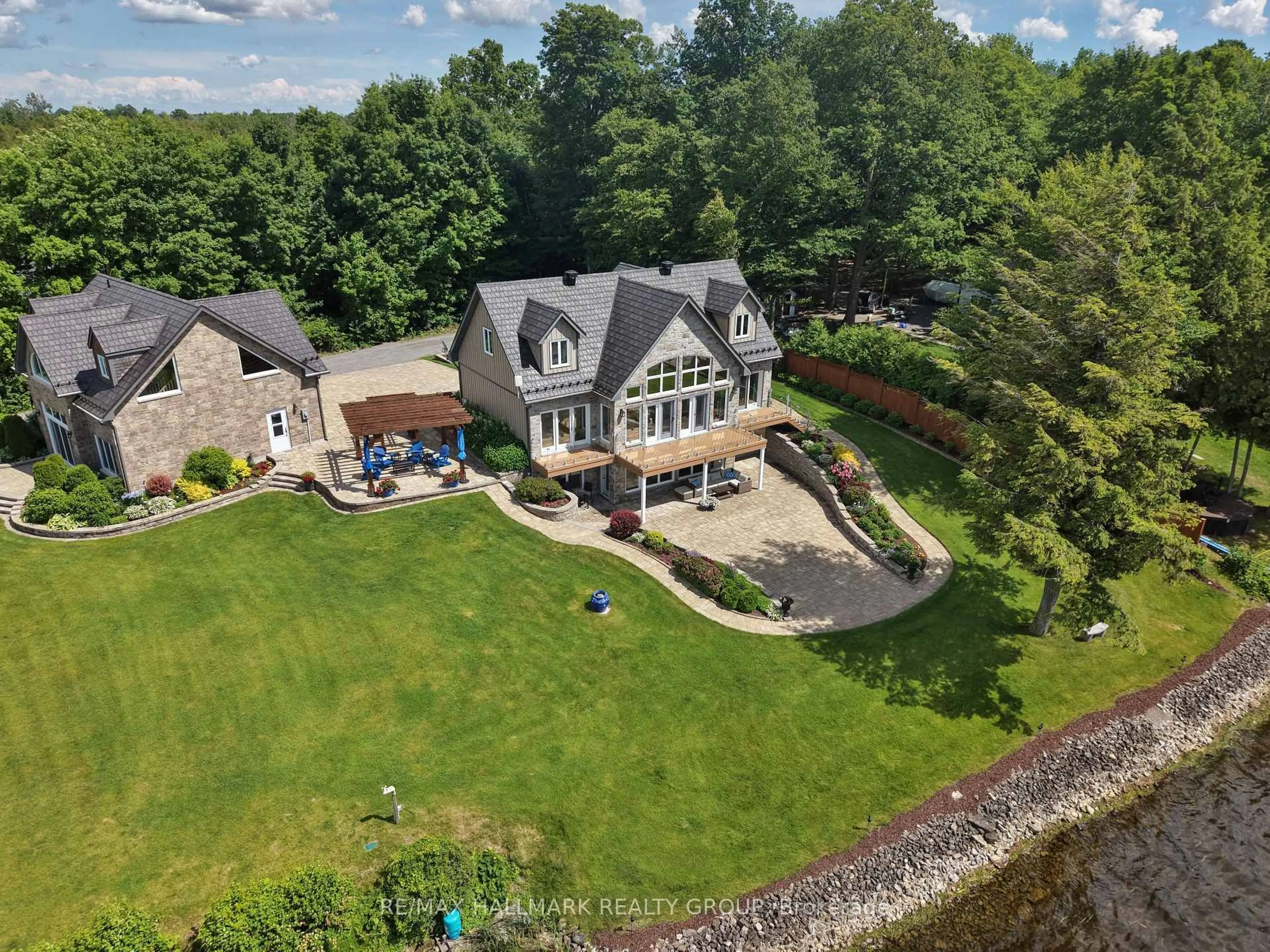 A pic from outside/outdoor area/front of a property/back of a property/a pic from drone, water/lake/river/ocean view for 6 R1 Rd, Rideau Lakes Ontario K7A 0C9