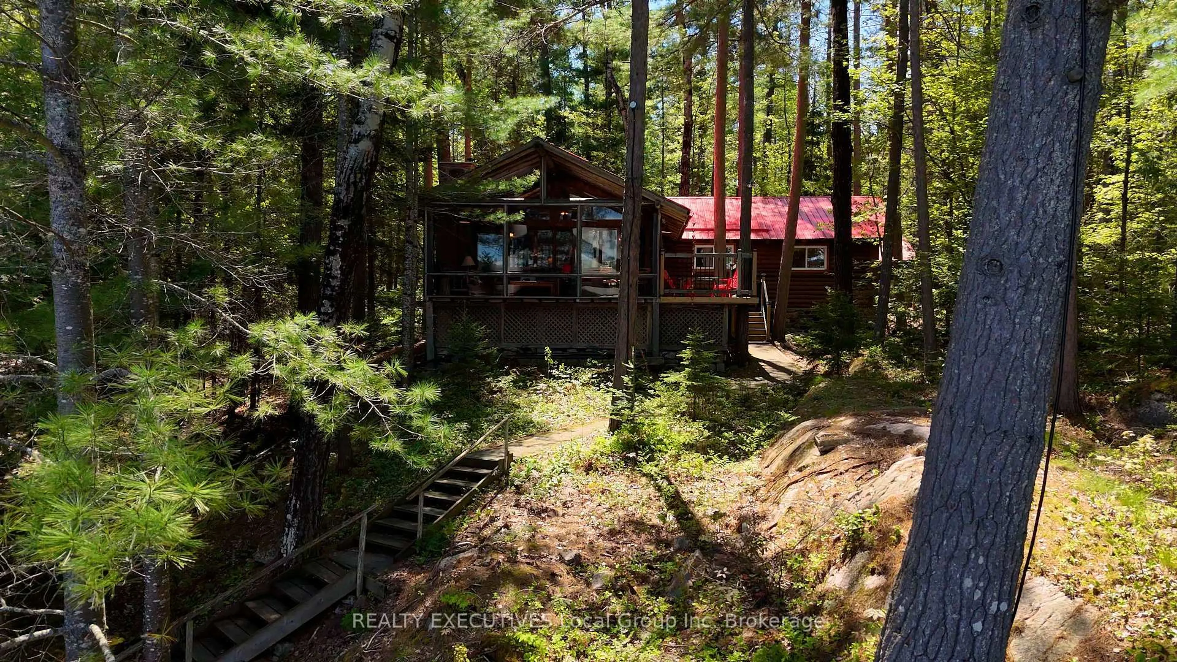 A pic from outside/outdoor area/front of a property/back of a property/a pic from drone, forest/trees view for 98 GREY ROCK Lane, Bonfield Ontario P0H 1E0