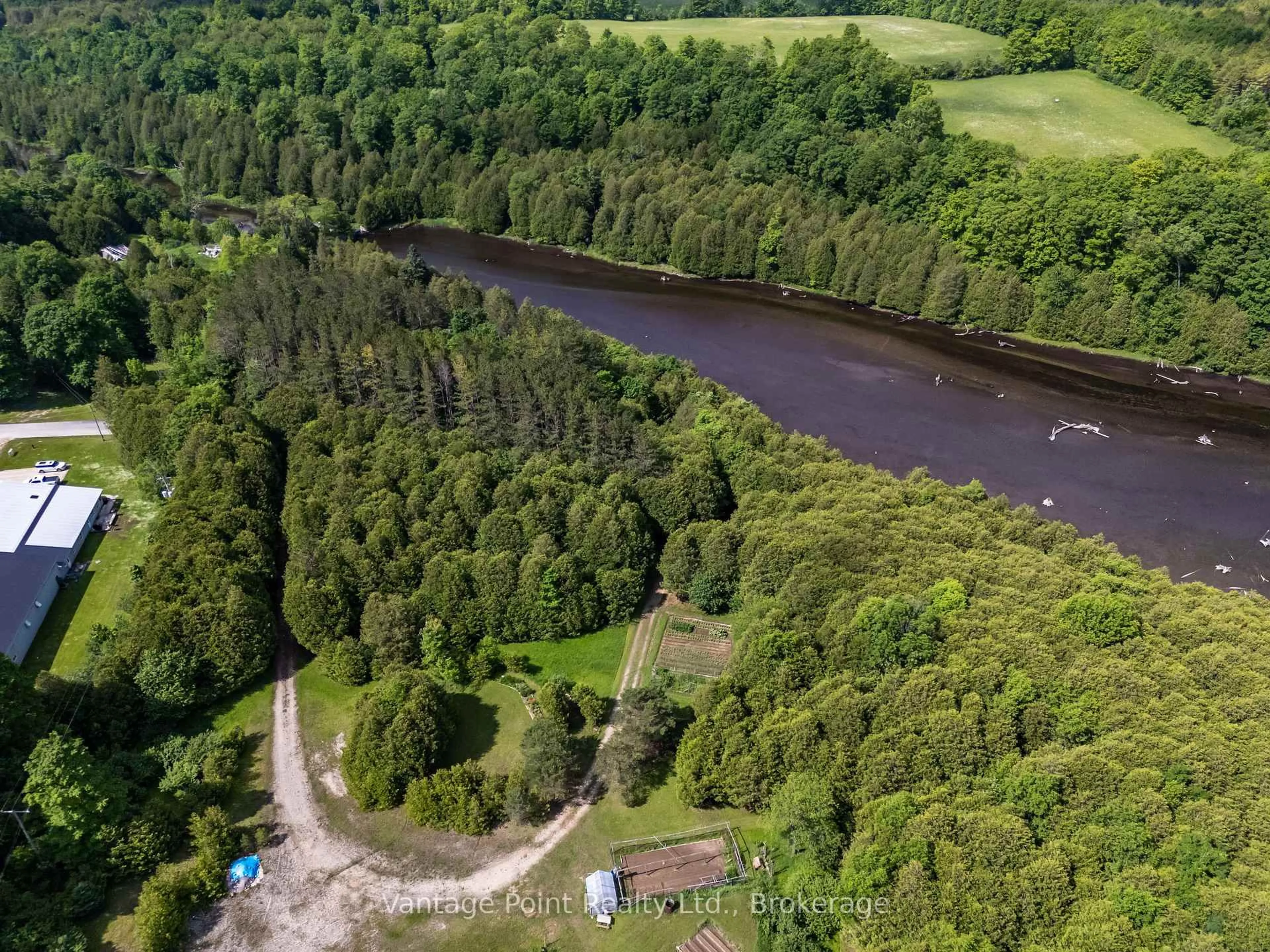 A pic from outside/outdoor area/front of a property/back of a property/a pic from drone, forest/trees view for 94 Fords Dr, Grey Highlands Ontario N0C 1H0
