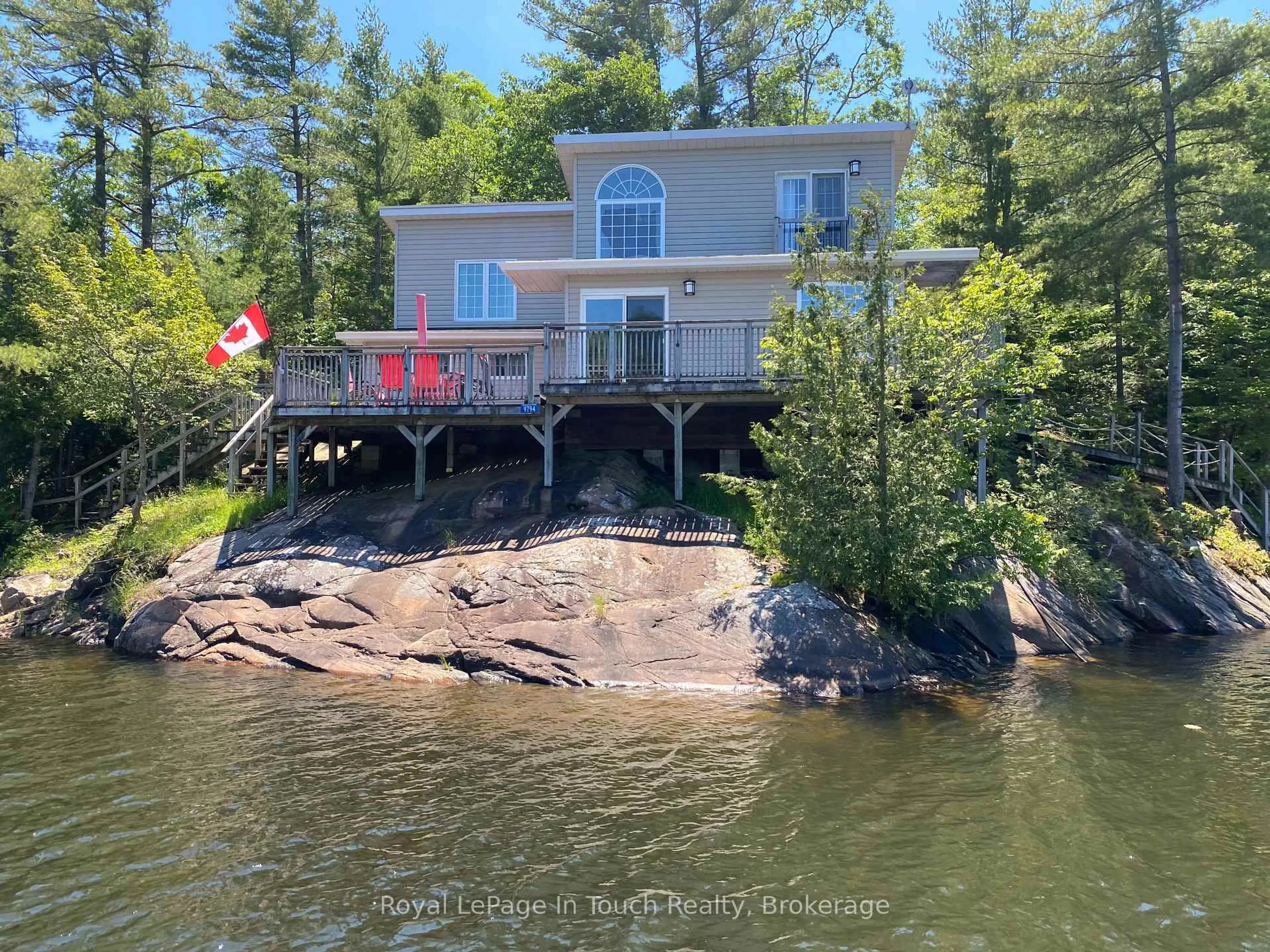 A pic from outside/outdoor area/front of a property/back of a property/a pic from drone, water/lake/river/ocean view for 9794 Georgian Bay Shore, Georgian Bay Ontario P0E 1E0