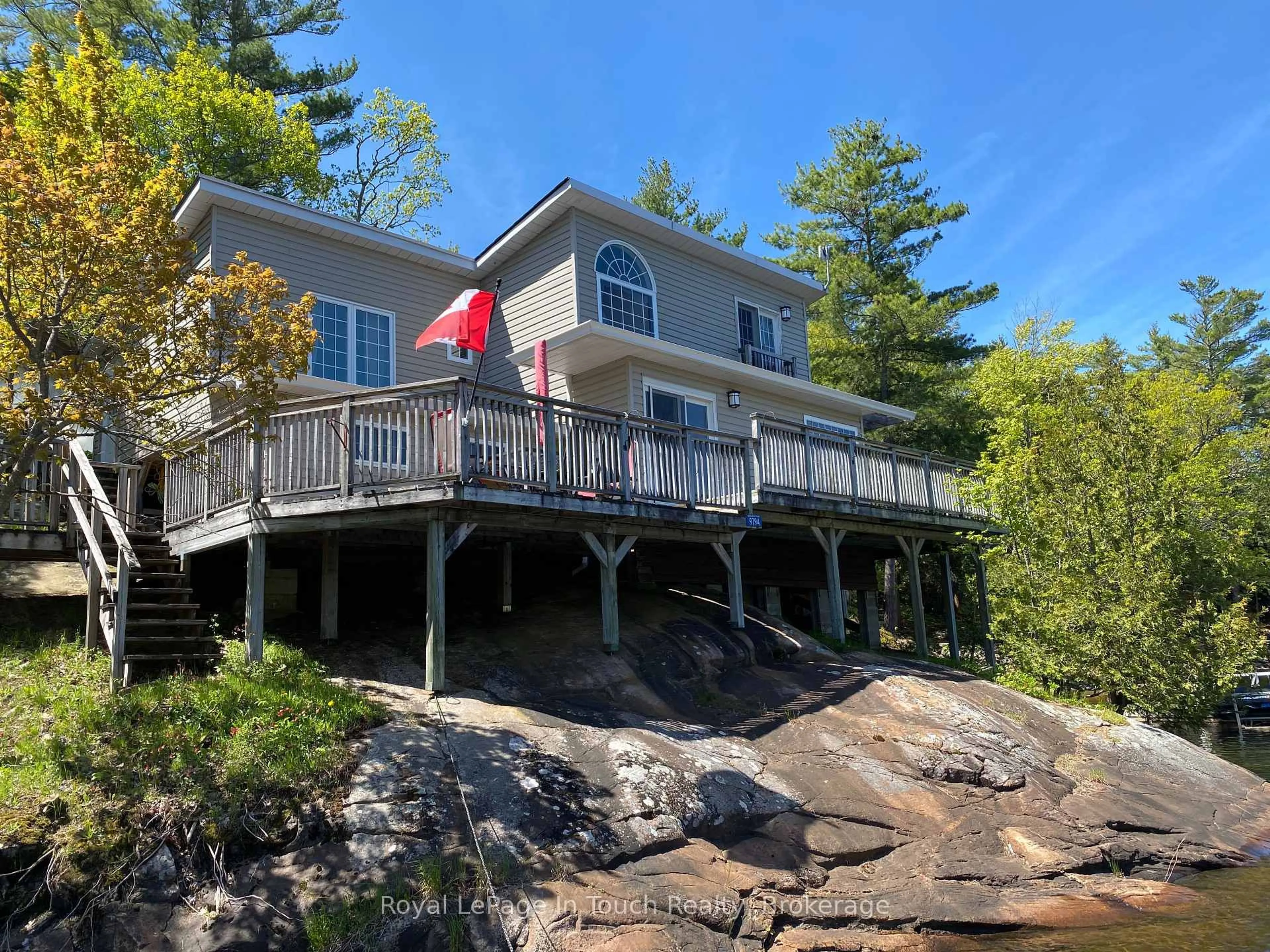 A pic from outside/outdoor area/front of a property/back of a property/a pic from drone, water/lake/river/ocean view for 9794 Georgian Bay Shore, Georgian Bay Ontario P0E 1E0