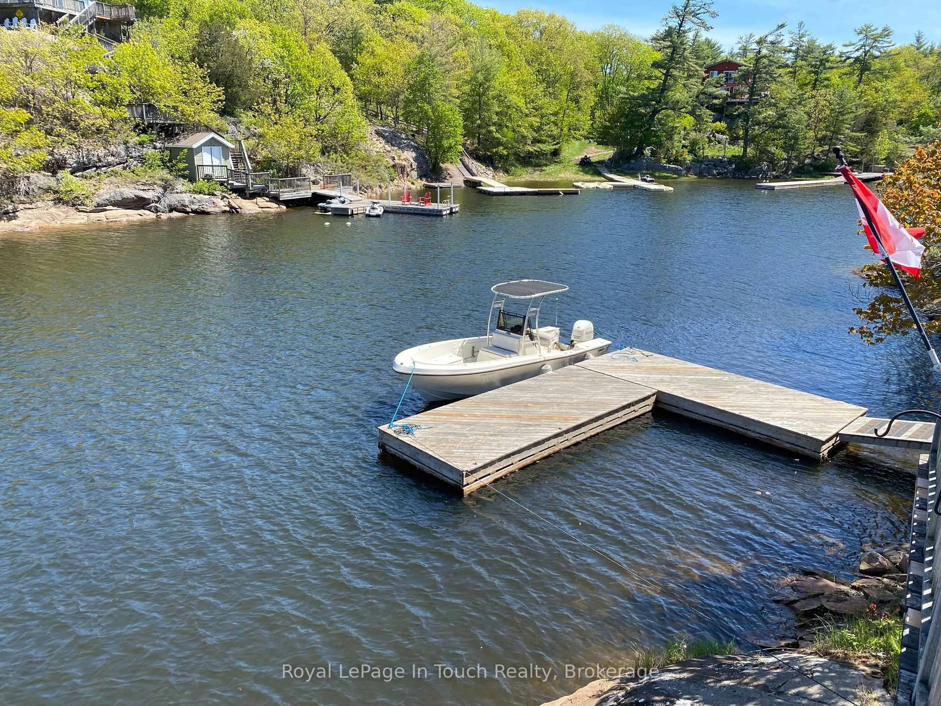 A pic from outside/outdoor area/front of a property/back of a property/a pic from drone, water/lake/river/ocean view for 9794 Georgian Bay Shore, Georgian Bay Ontario P0E 1E0