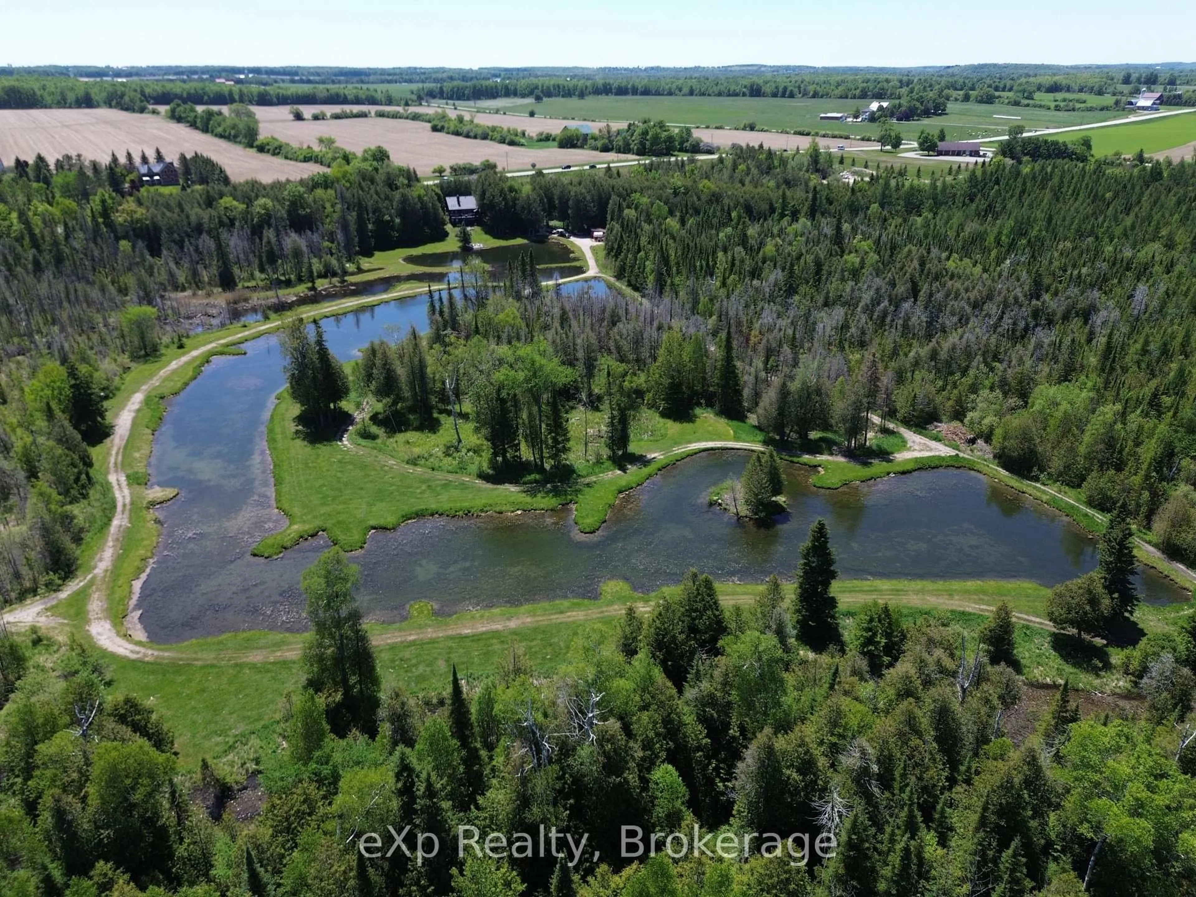 A pic from outside/outdoor area/front of a property/back of a property/a pic from drone, water/lake/river/ocean view for 407047 Grey 4 Rd, Grey Highlands Ontario N0C 1E0