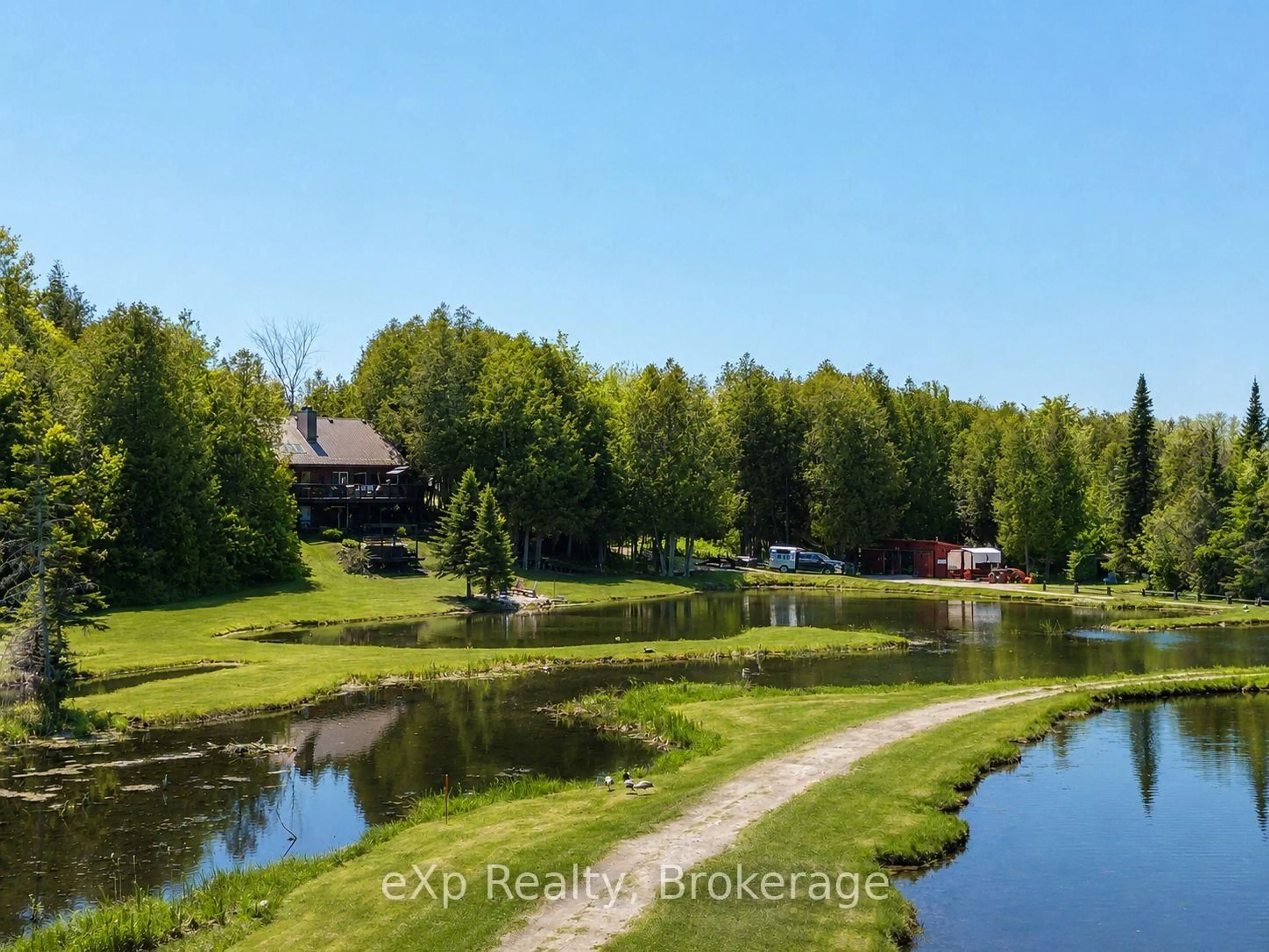 A pic from outside/outdoor area/front of a property/back of a property/a pic from drone, water/lake/river/ocean view for 407047 Grey 4 Rd, Grey Highlands Ontario N0C 1E0