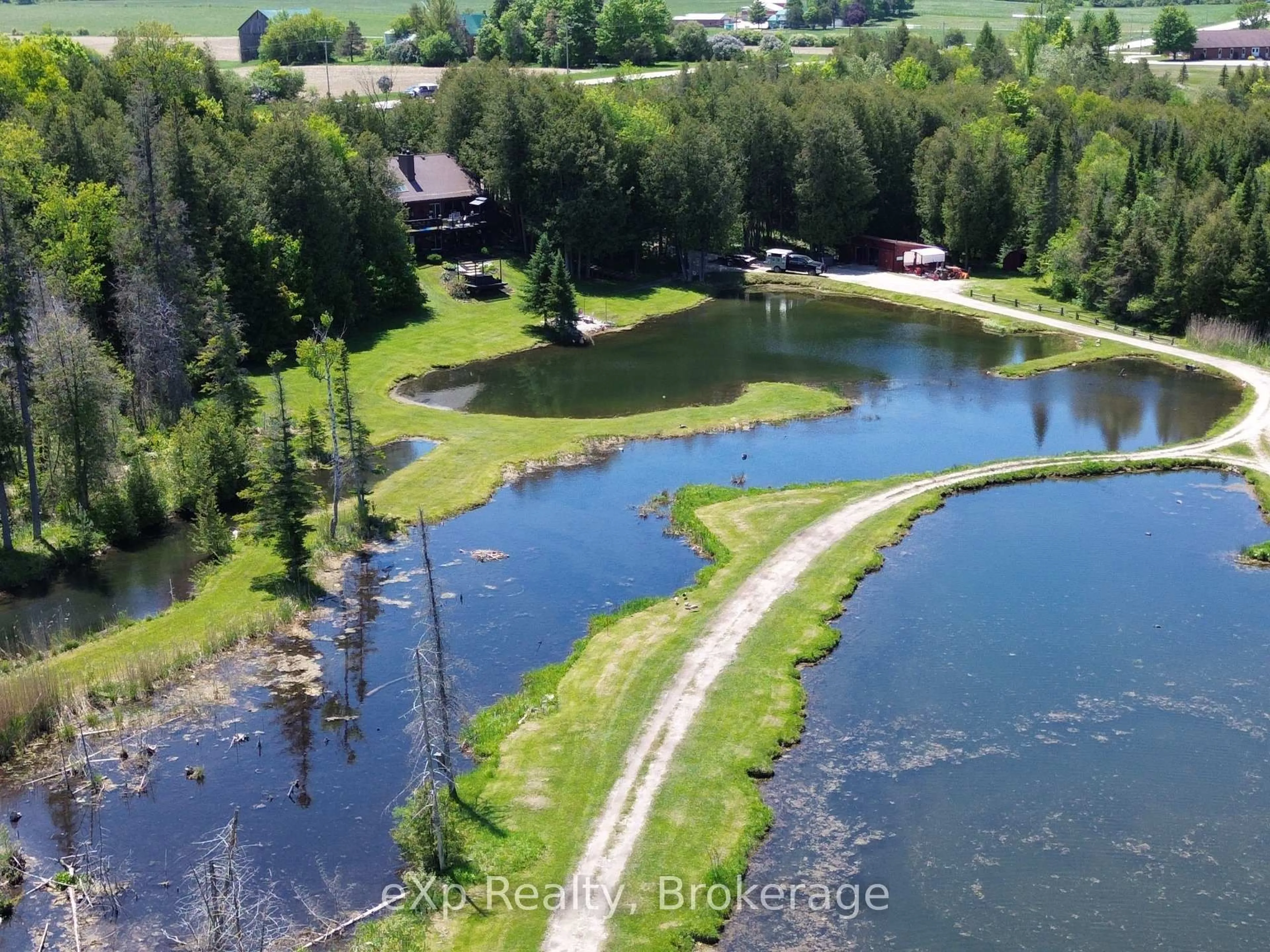 A pic from outside/outdoor area/front of a property/back of a property/a pic from drone, water/lake/river/ocean view for 407047 Grey 4 Rd, Grey Highlands Ontario N0C 1E0