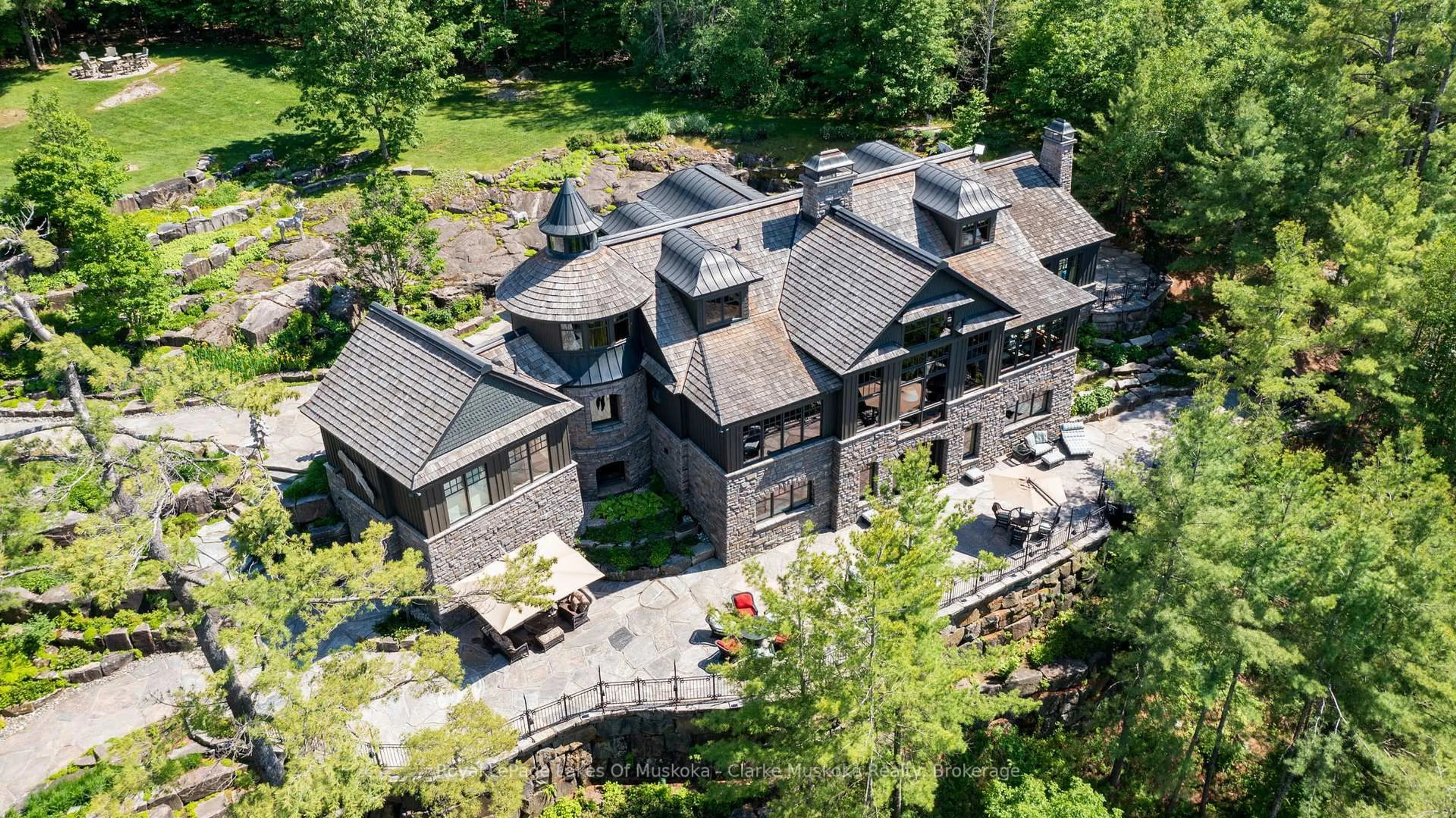 A pic from outside/outdoor area/front of a property/back of a property/a pic from drone, building for 1108 Robert Johnston Rd #1, Muskoka Lakes Ontario P0B 1J0