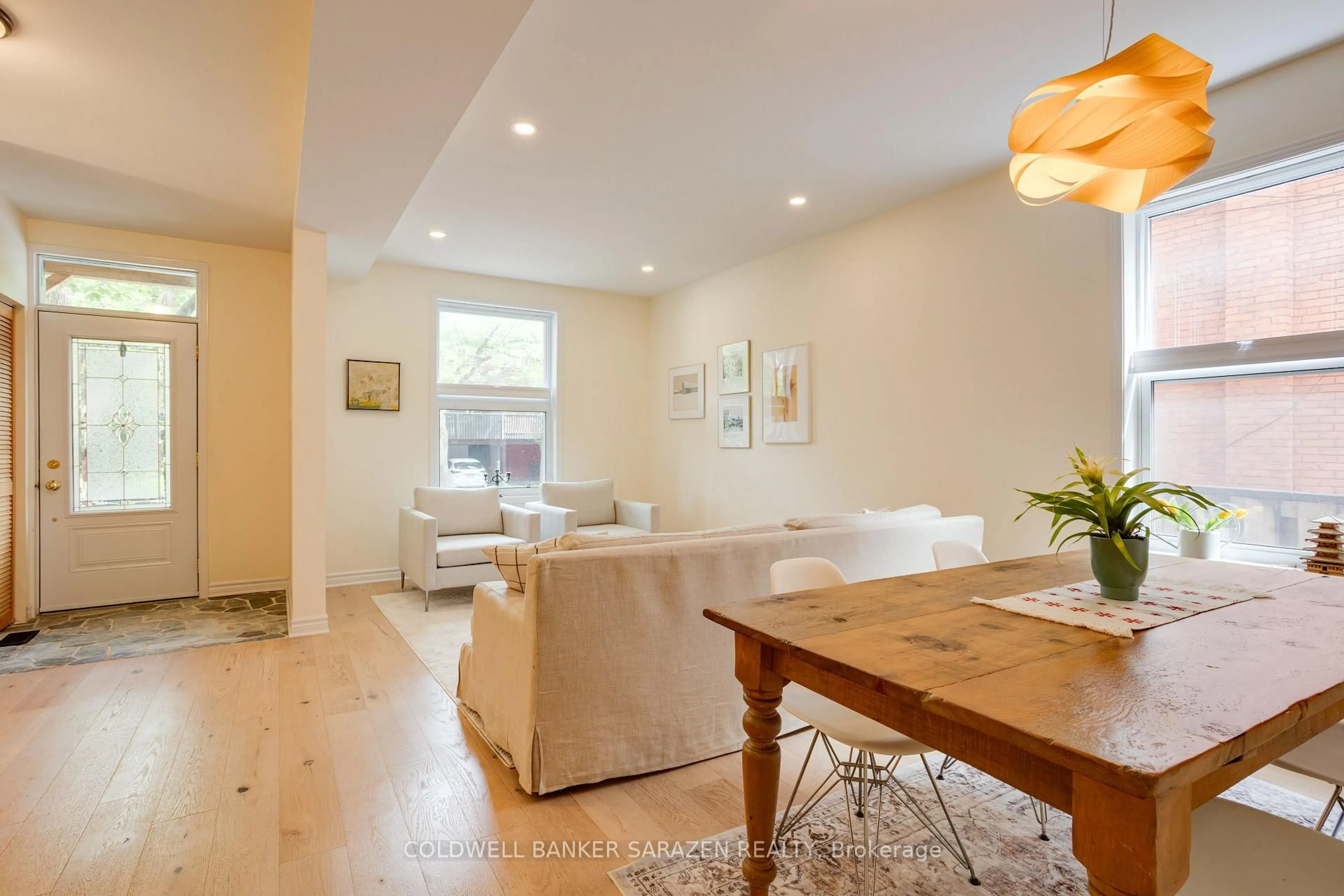 Living room with furniture, wood/laminate floor for 158 Primrose Ave, Ottawa Ontario K1R 6M5
