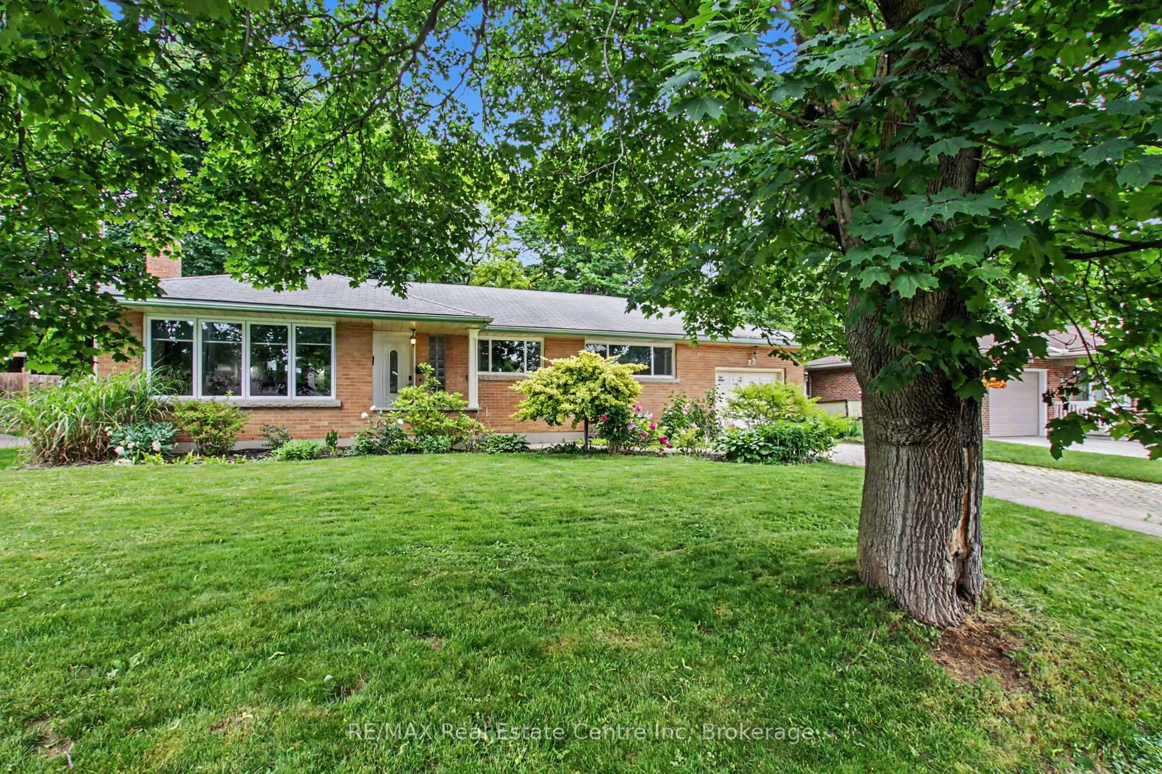Home with brick exterior material, street for 23 Glenburnie Dr, Guelph Ontario N1E 4C4