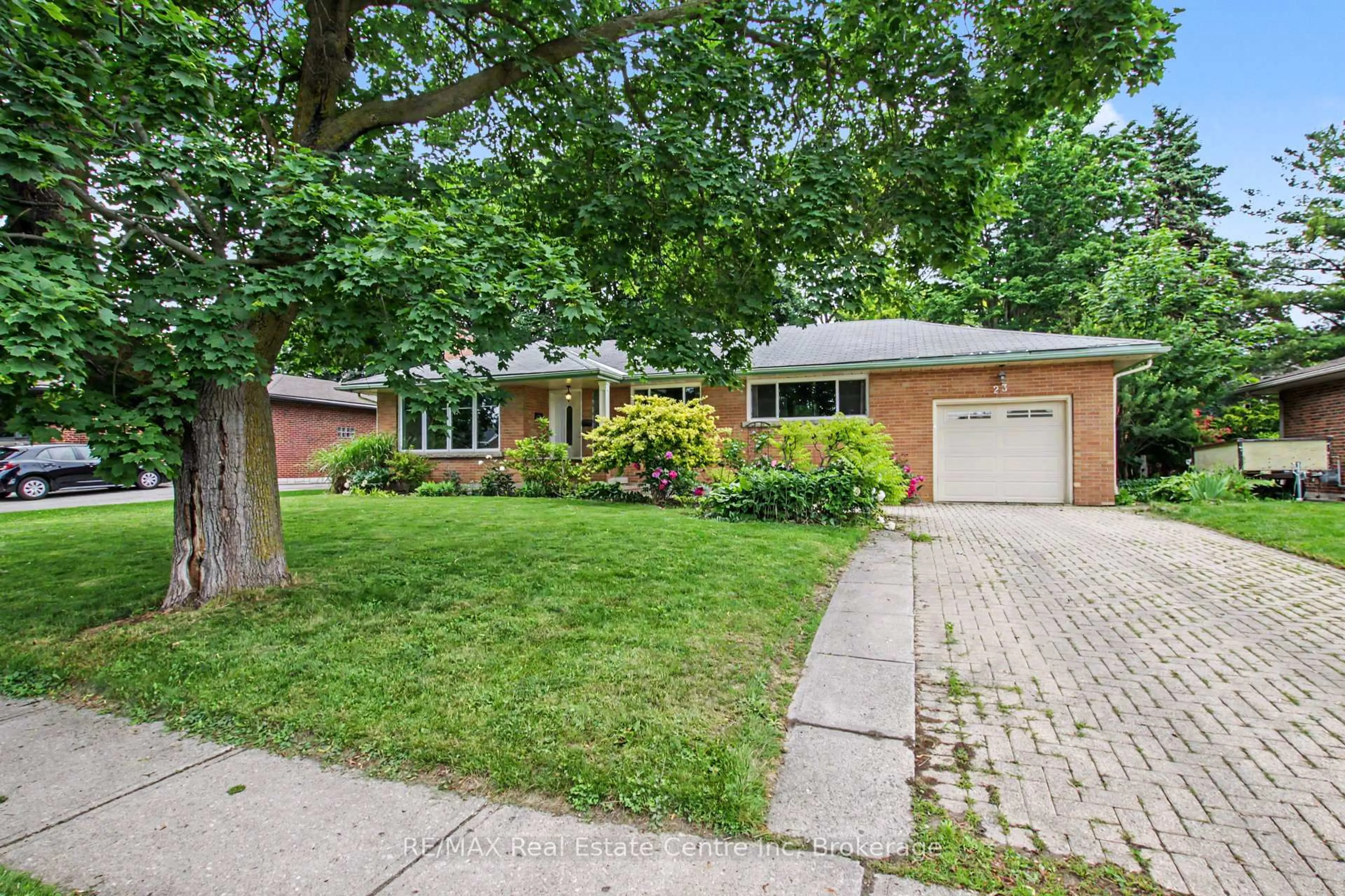 Home with brick exterior material, street for 23 Glenburnie Dr, Guelph Ontario N1E 4C4