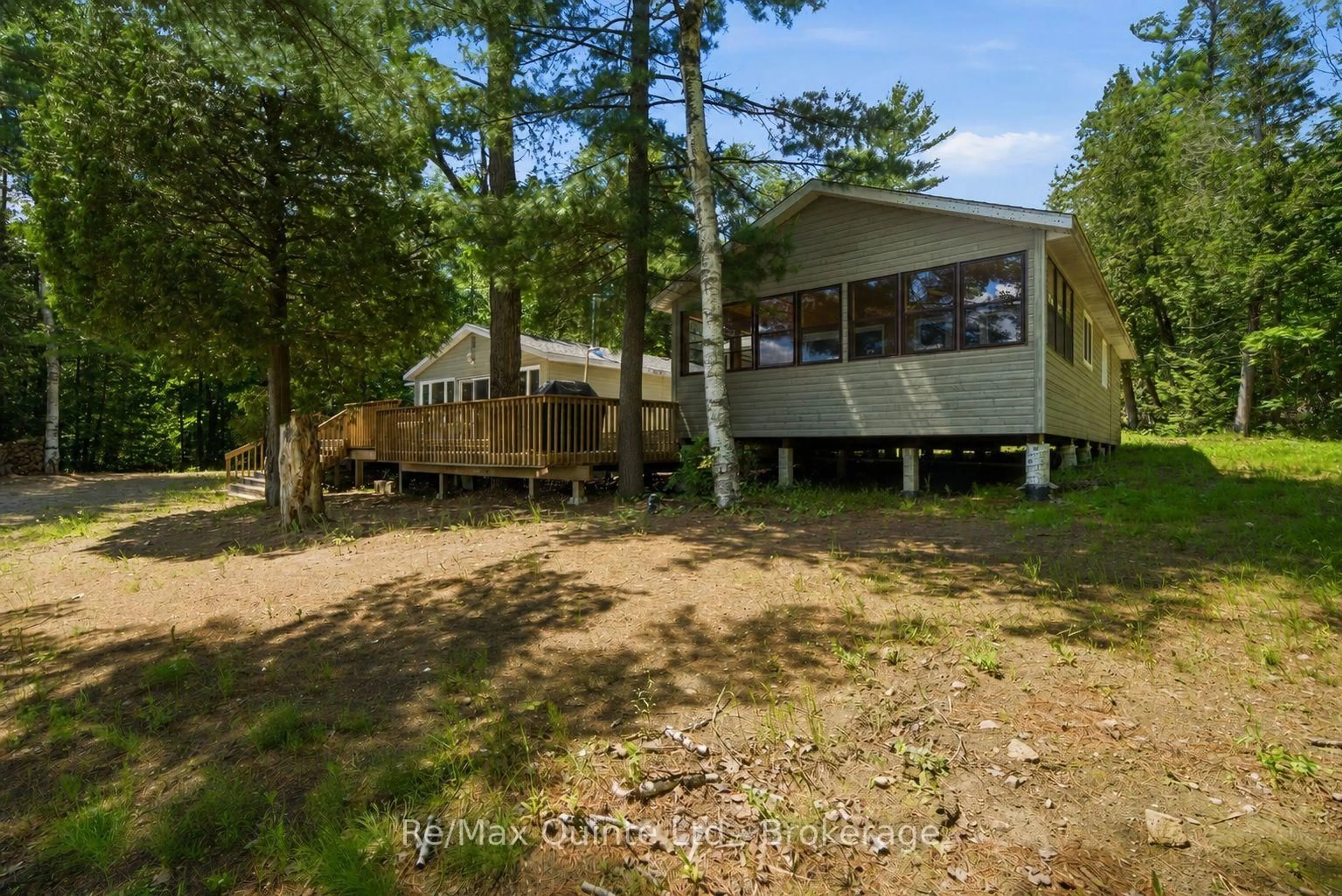 A pic from outside/outdoor area/front of a property/back of a property/a pic from drone, water/lake/river/ocean view for 1731 Hughes Landing Rd, Cloyne Ontario K0H 1K0
