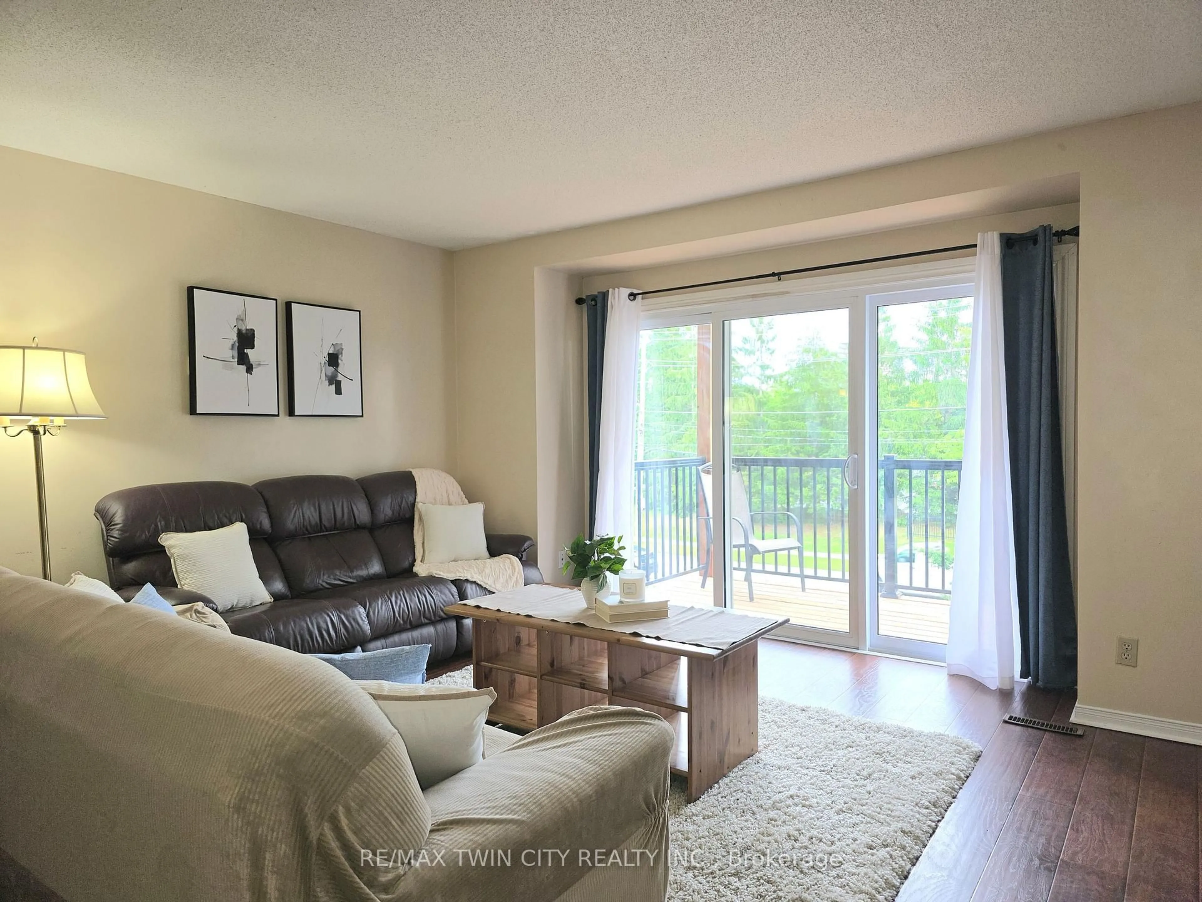 Living room with furniture, wood/laminate floor for 250 Keats Way #6, Waterloo Ontario N2L 6J5