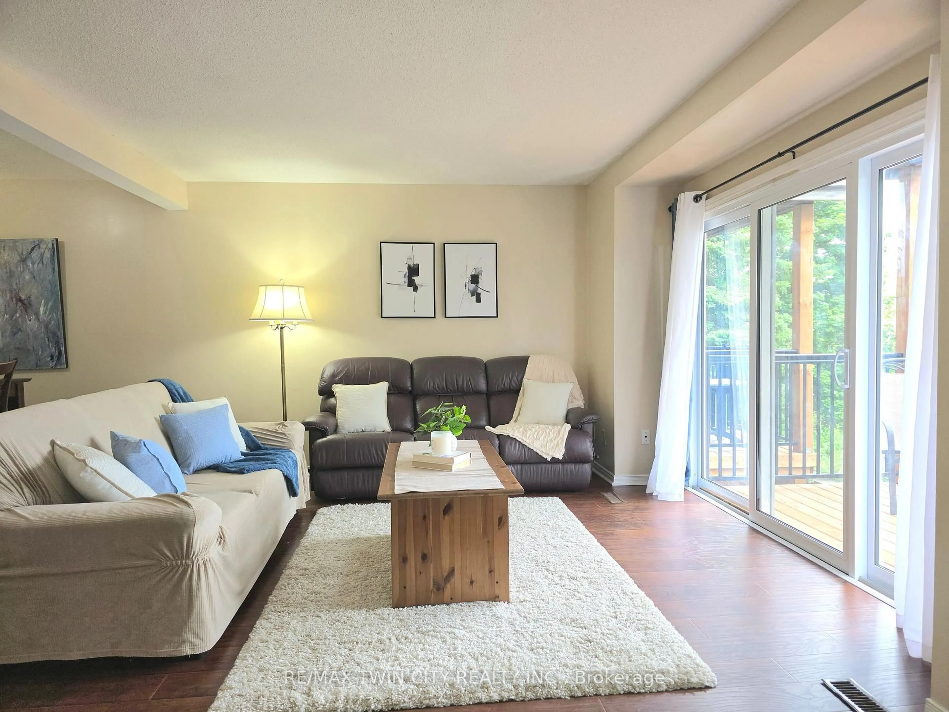 Living room with furniture, wood/laminate floor for 250 Keats Way #6, Waterloo Ontario N2L 6J5