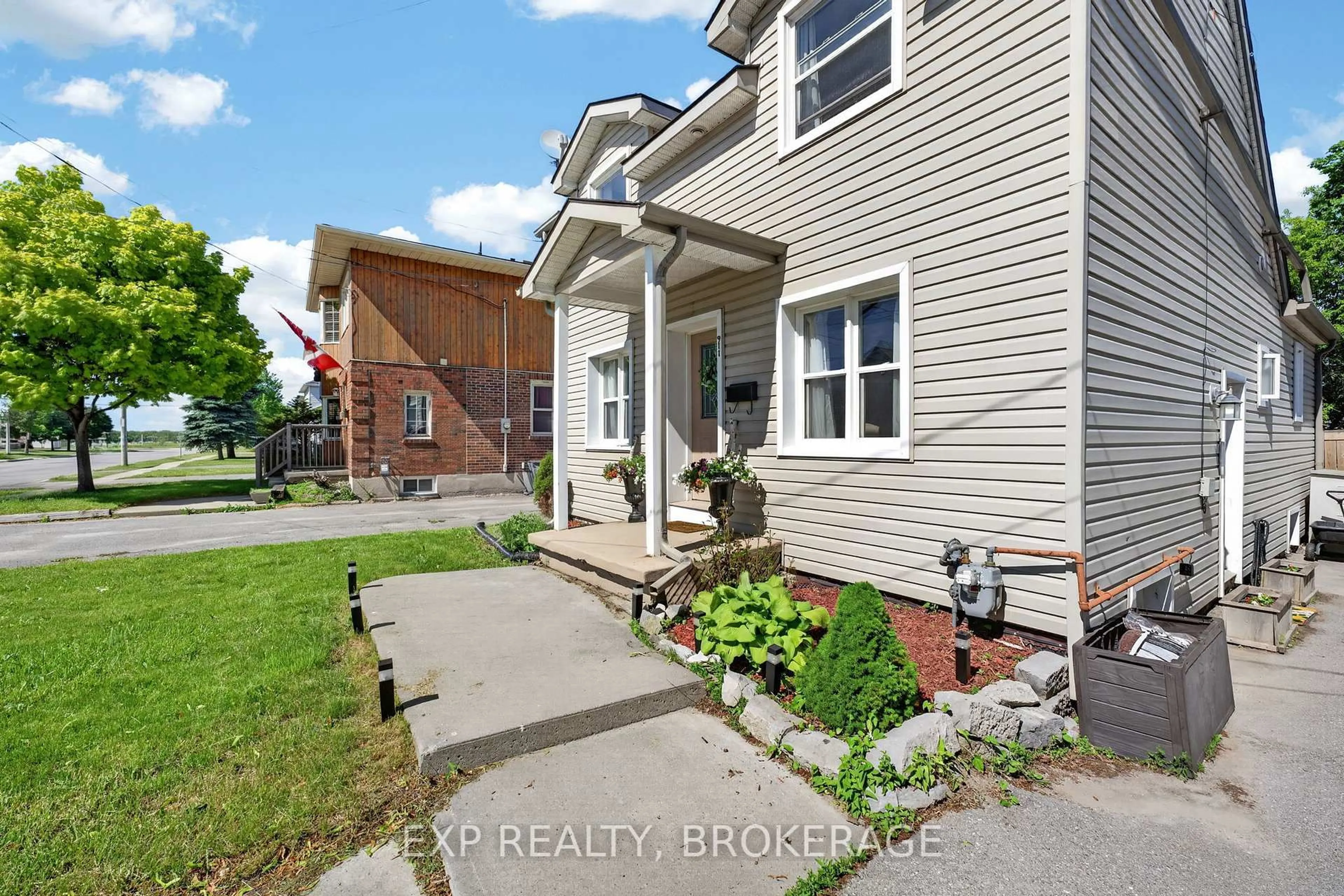 Home with brick exterior material, street for 911 Division St, Kingston Ontario K7K 4C6