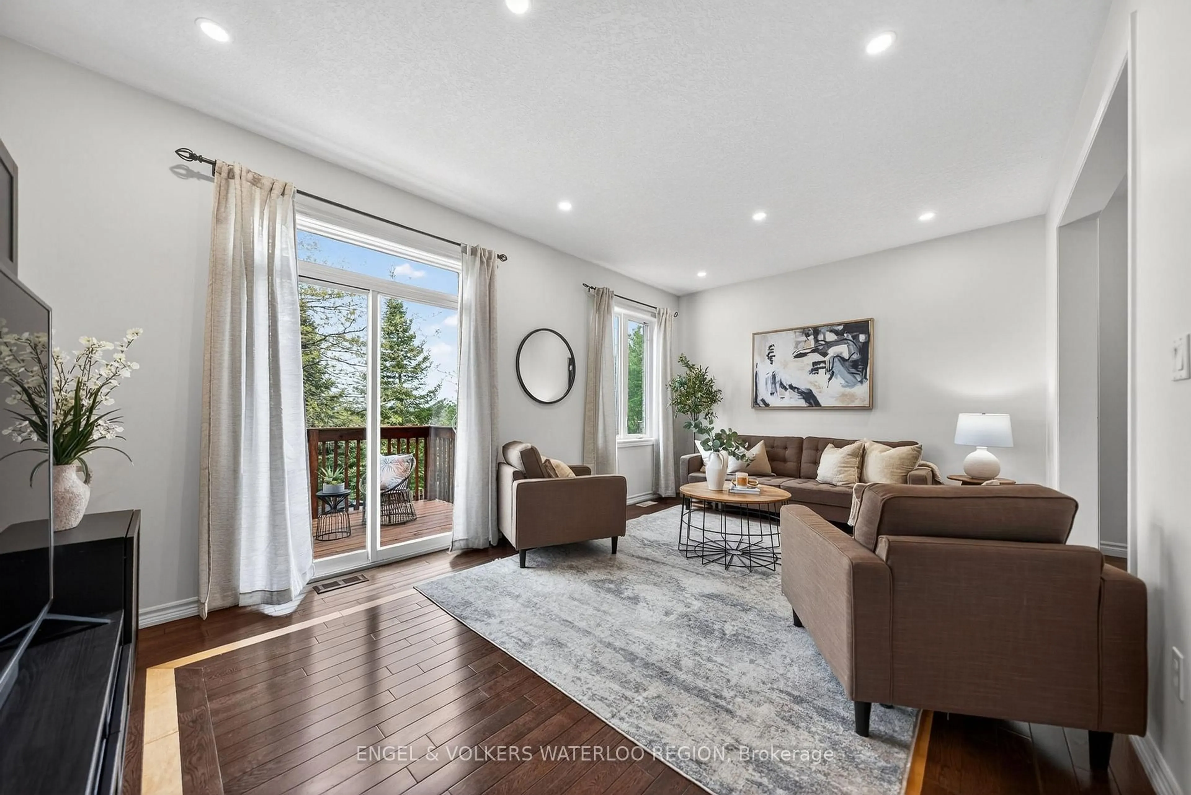 Living room with furniture, wood/laminate floor for 533 Wasaga Cres, Waterloo Ontario N2V 2Y8