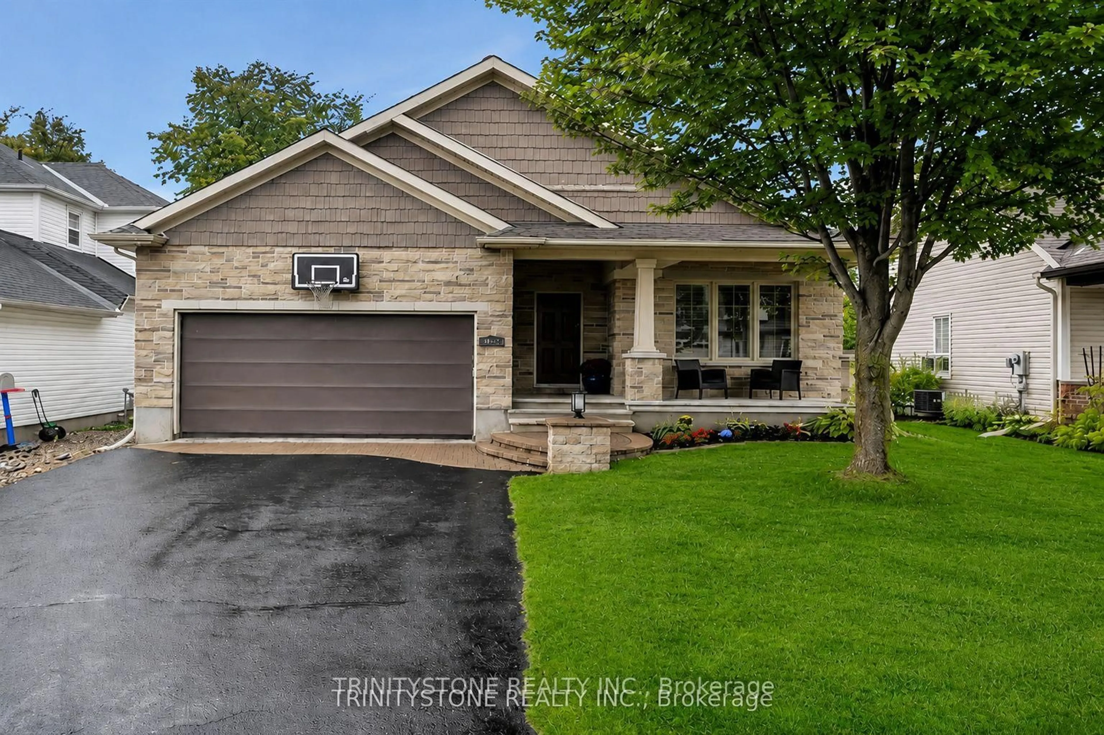 Home with brick exterior material, street for 452 Landswood Way, Ottawa Ontario K2S 0A4