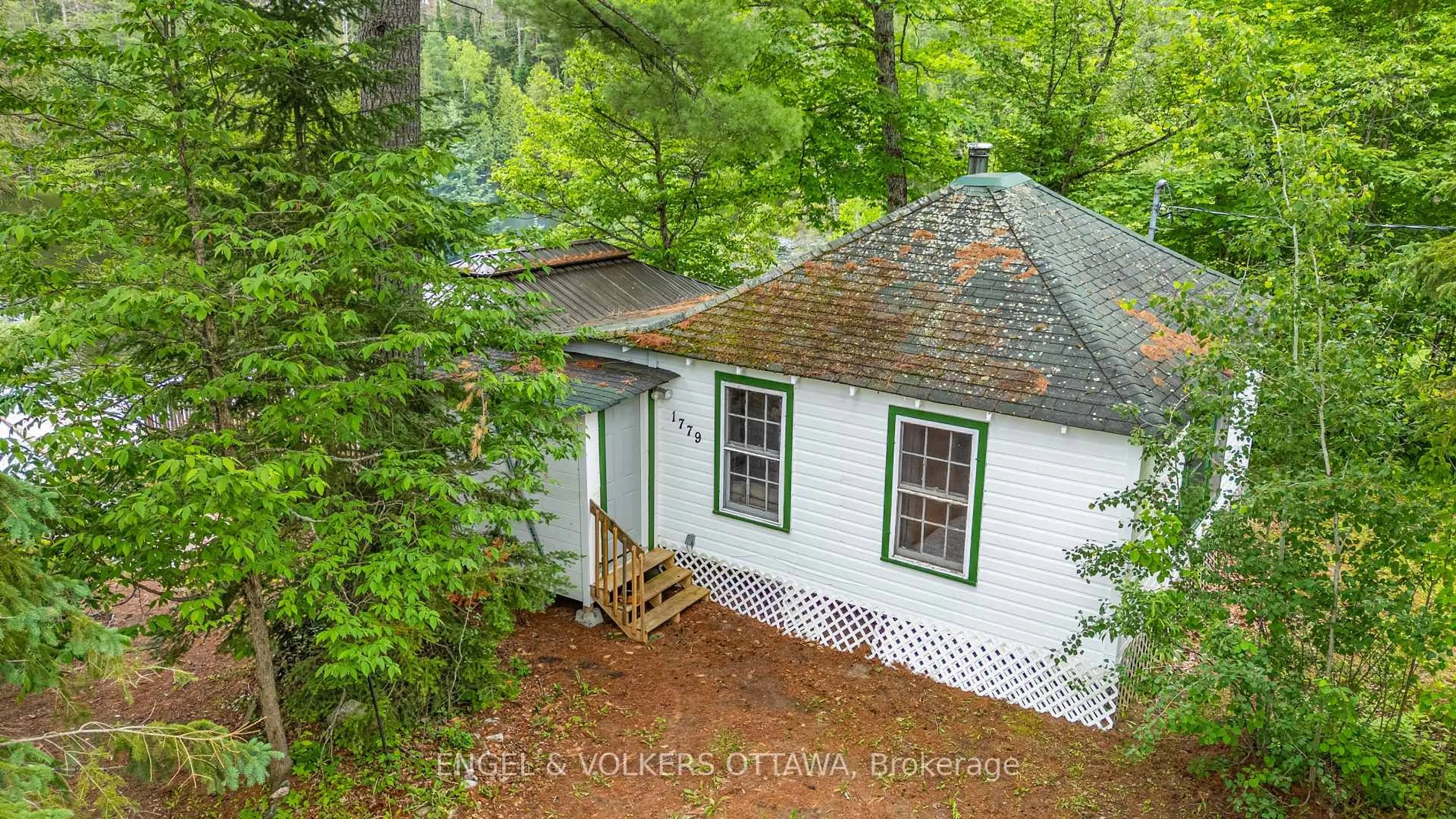 A pic from outside/outdoor area/front of a property/back of a property/a pic from drone, forest/trees view for 1779 Centennial Lake Rd, Calabogie Ontario K0J 1H0
