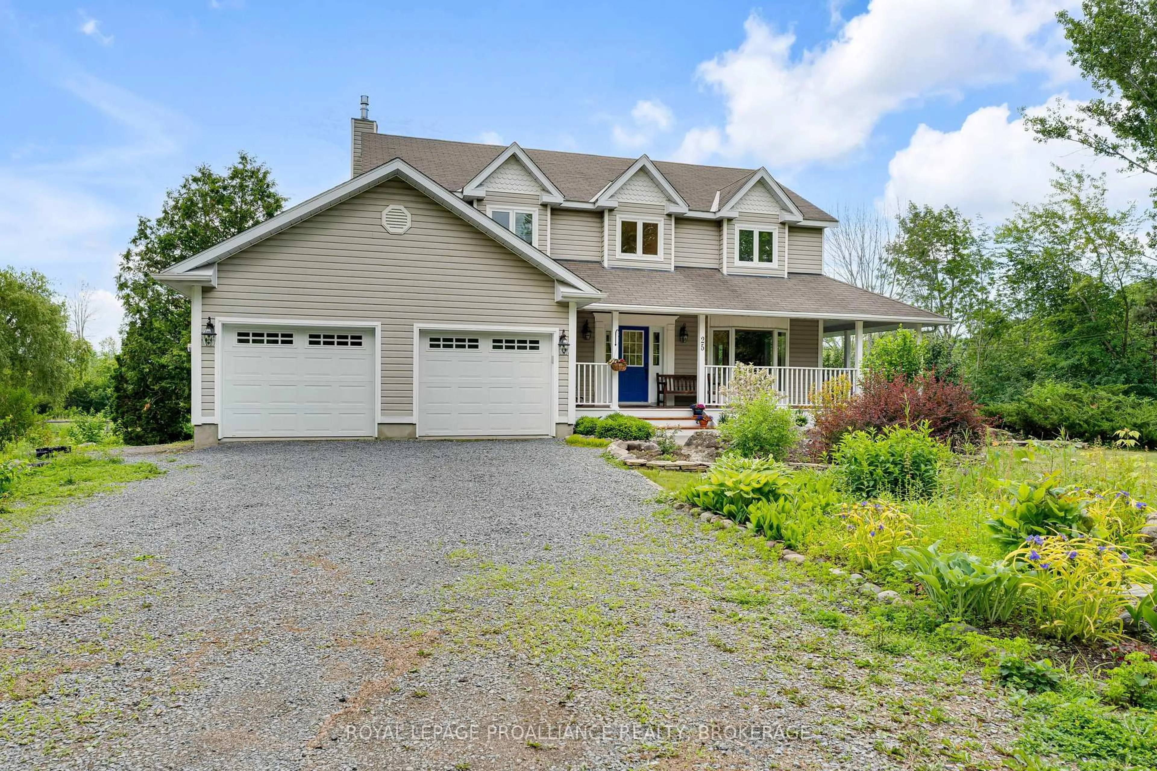 Home with vinyl exterior material, street for 25 Howe Island Ferry Rd, Kingston Ontario K7L 4V1