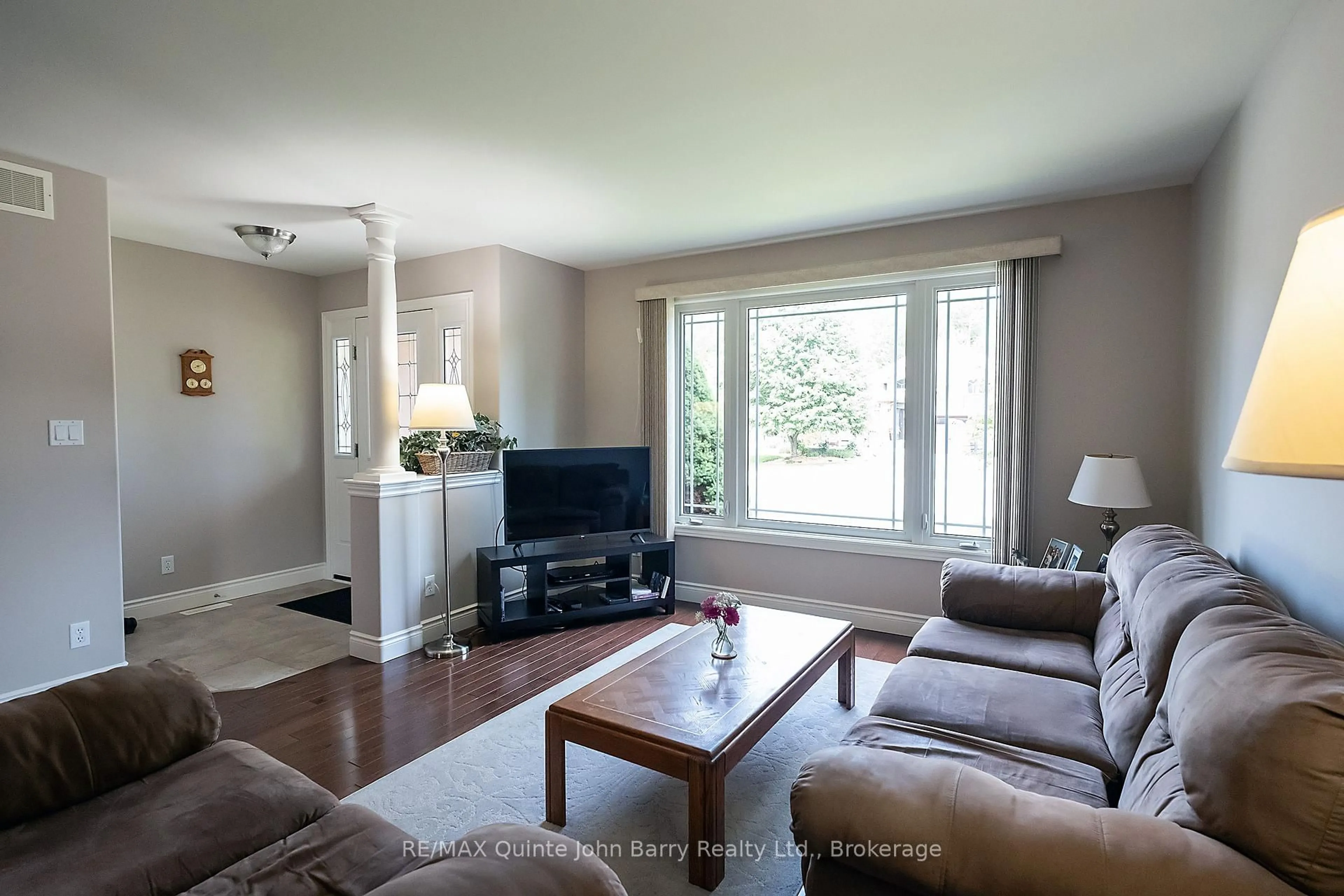 Living room with furniture, wood/laminate floor for 4 Algonquin Ave, Brighton Ontario K0K 1H0