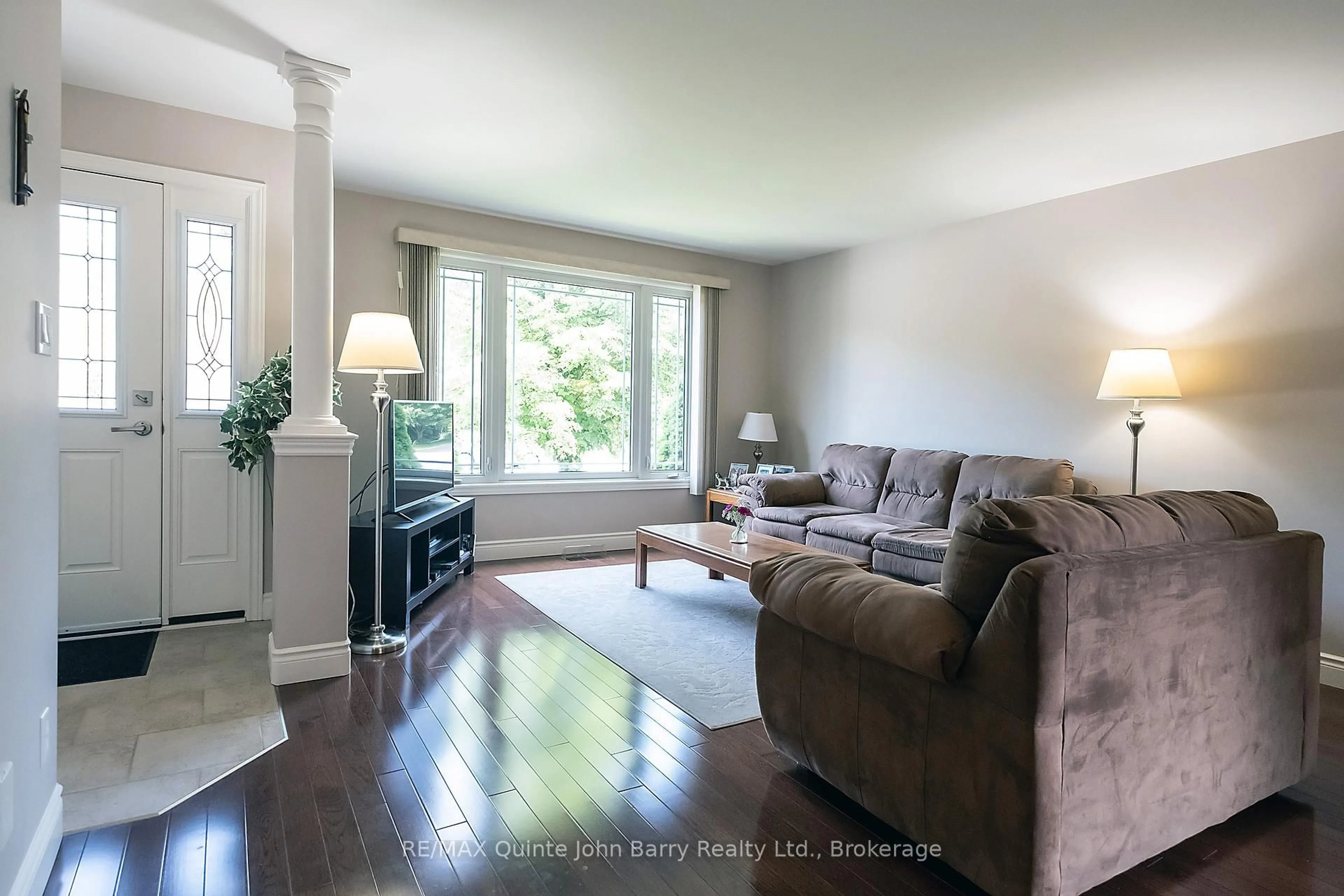 Living room with furniture, wood/laminate floor for 4 Algonquin Ave, Brighton Ontario K0K 1H0