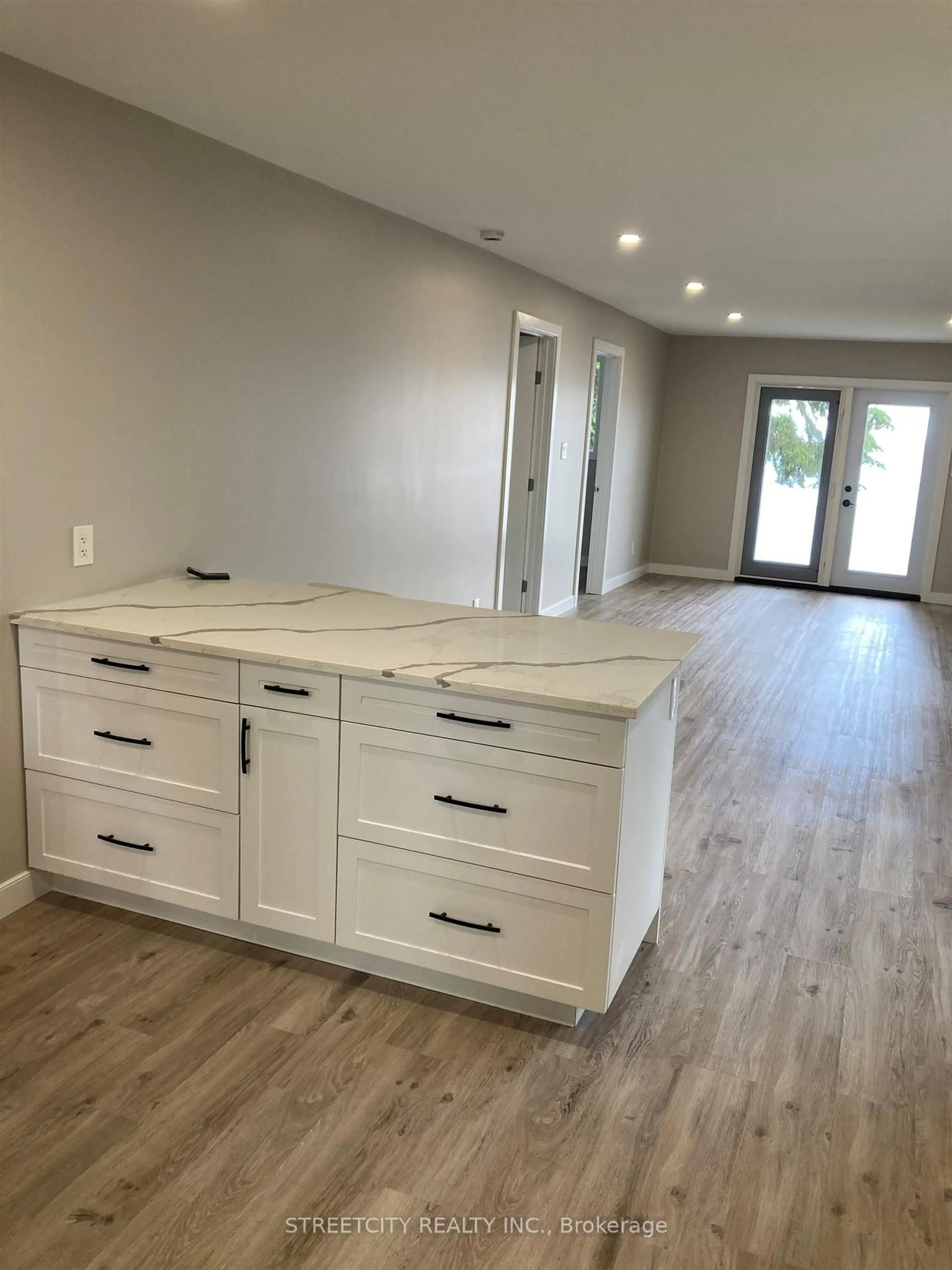 Open concept kitchen, wood/laminate floor for 456 East Floral Beach Rd, Shuniah Ontario P7A 0H1