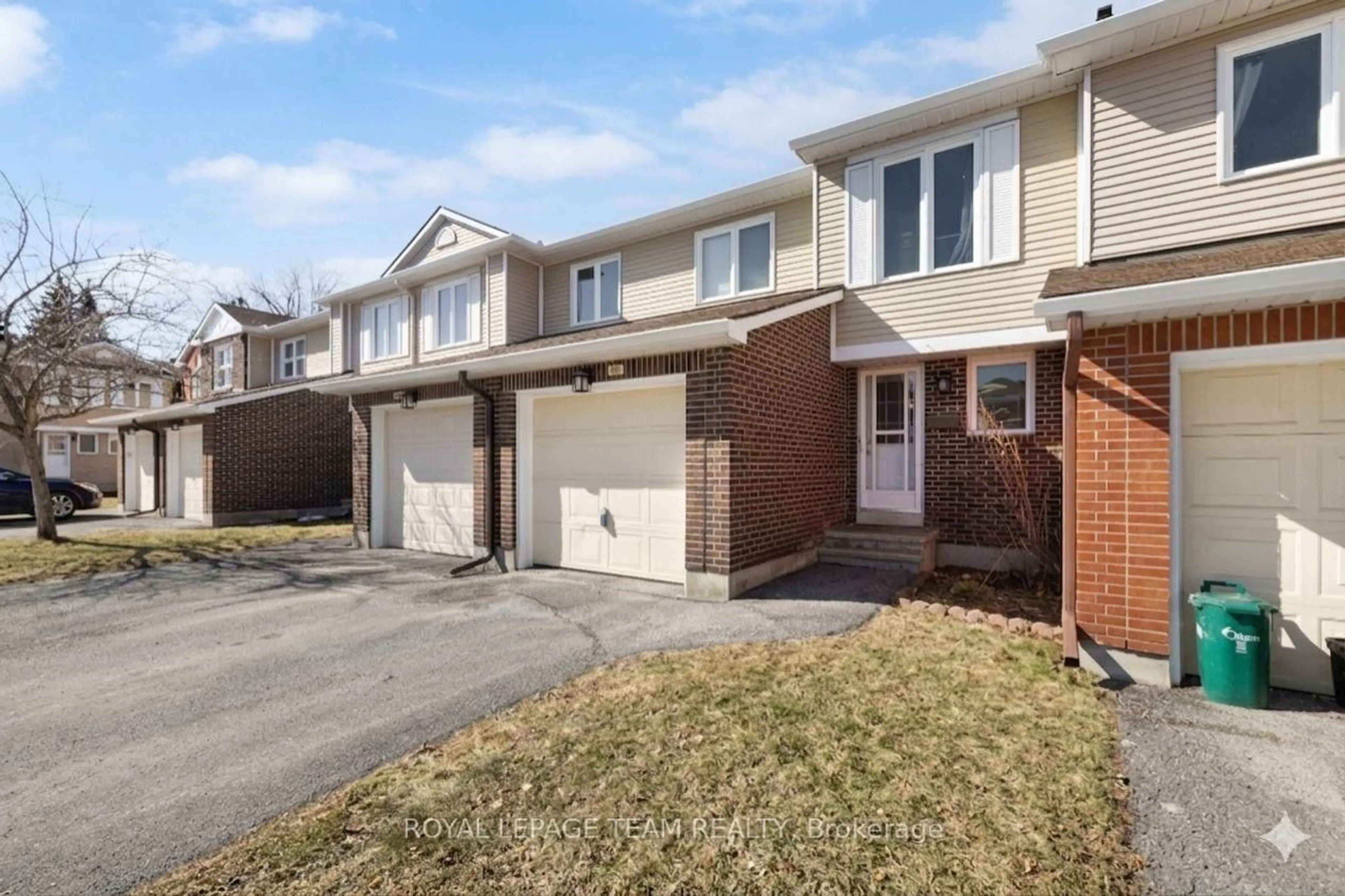 Home with brick exterior material, street for 10 Millrise Lane #E, Ottawa Ontario K2G 5E6