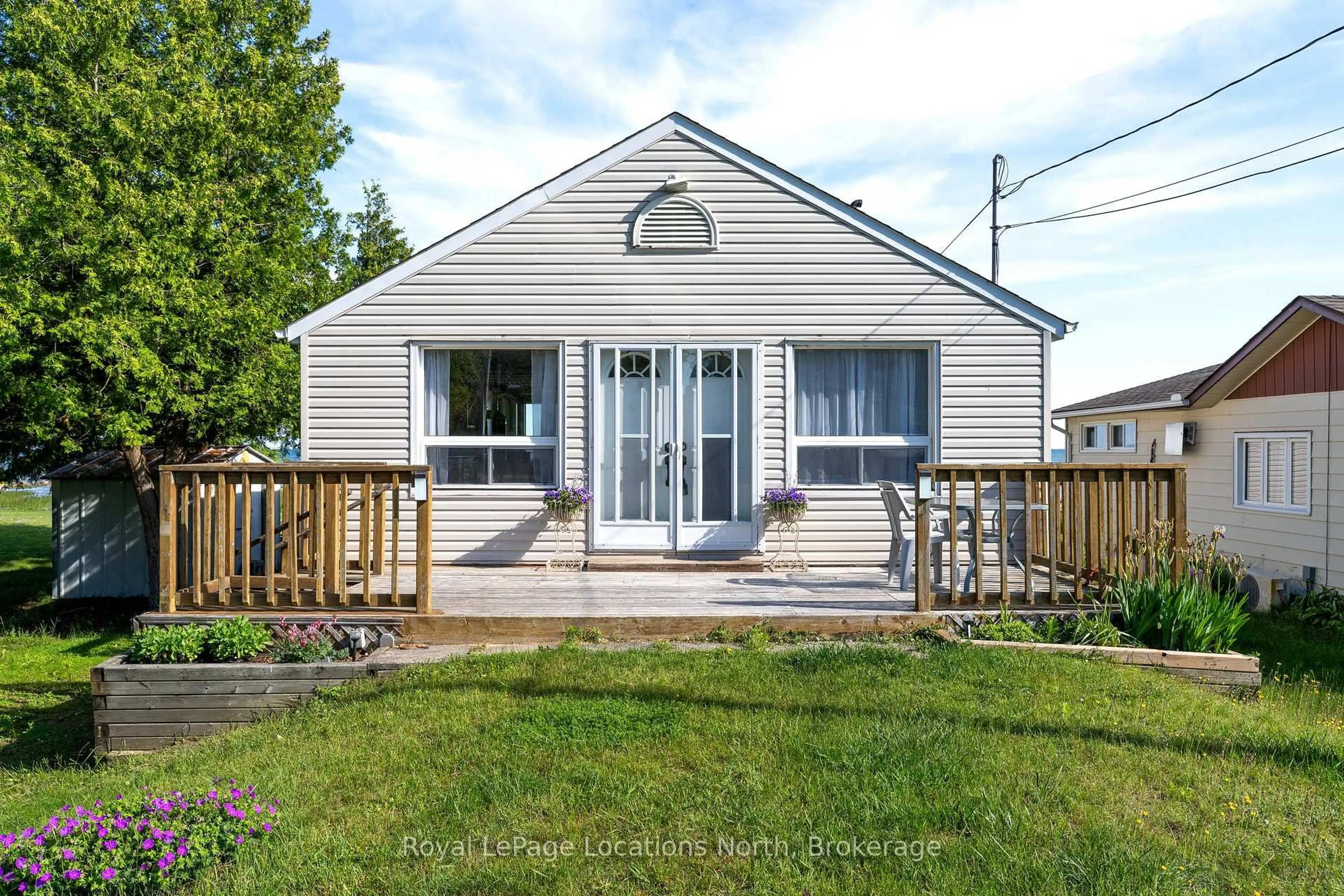 Home with vinyl exterior material, street for 233 Brophy's Lane, Blue Mountains Ontario L9Y 0K5