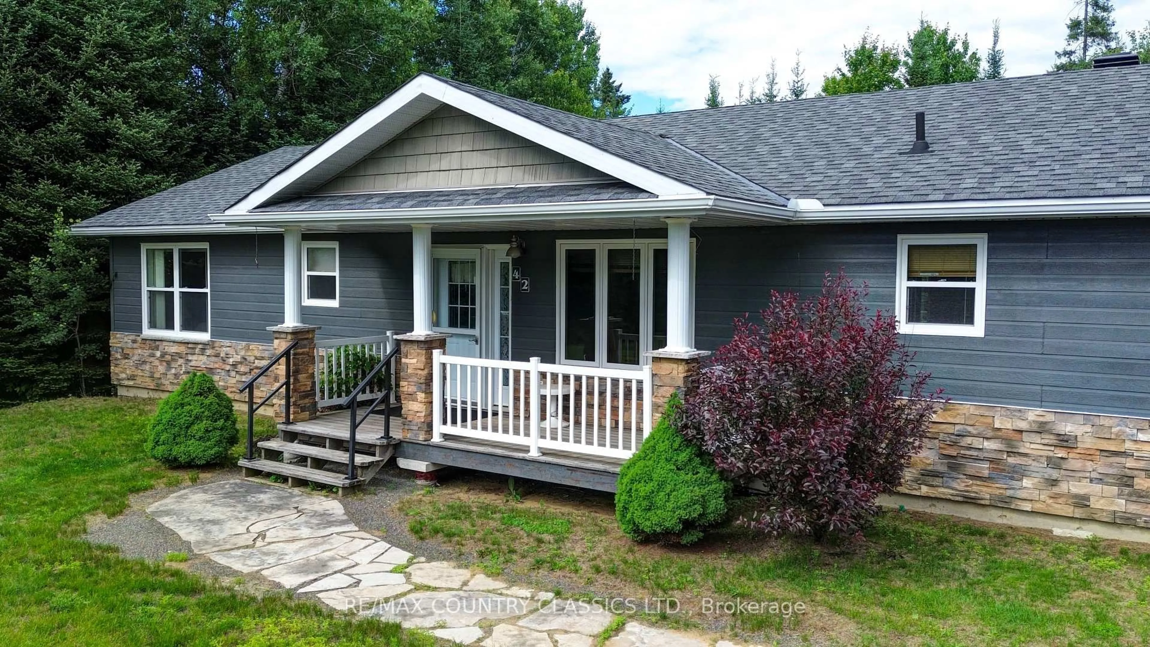 Home with vinyl exterior material, street for 42 Nicklaus Dr, Bancroft Ontario K0L 1C0