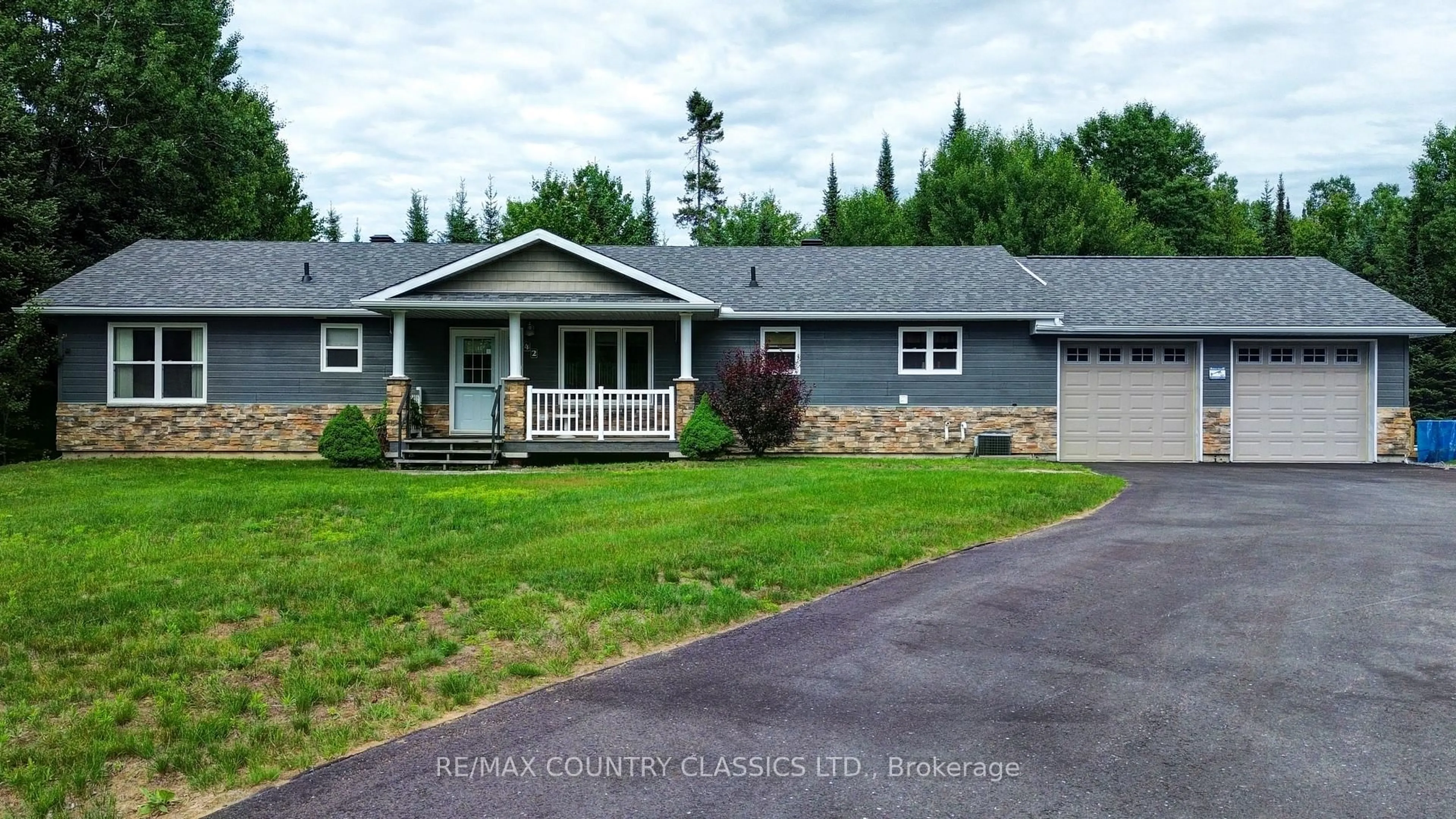 Home with vinyl exterior material, street for 42 Nicklaus Dr, Bancroft Ontario K0L 1C0