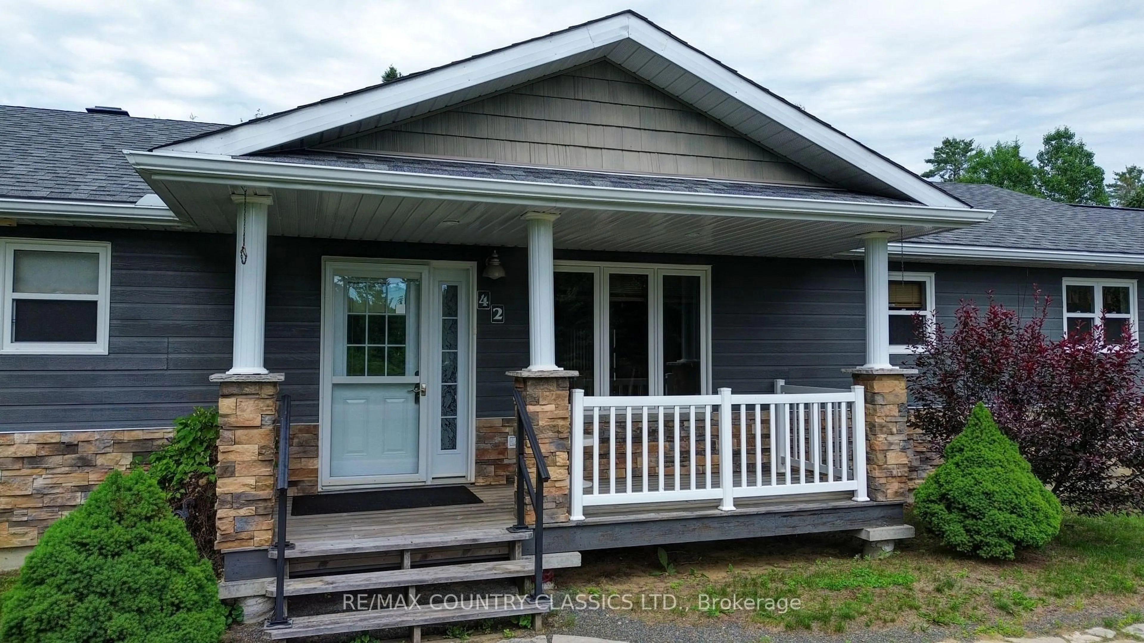 Home with vinyl exterior material, street for 42 Nicklaus Dr, Bancroft Ontario K0L 1C0