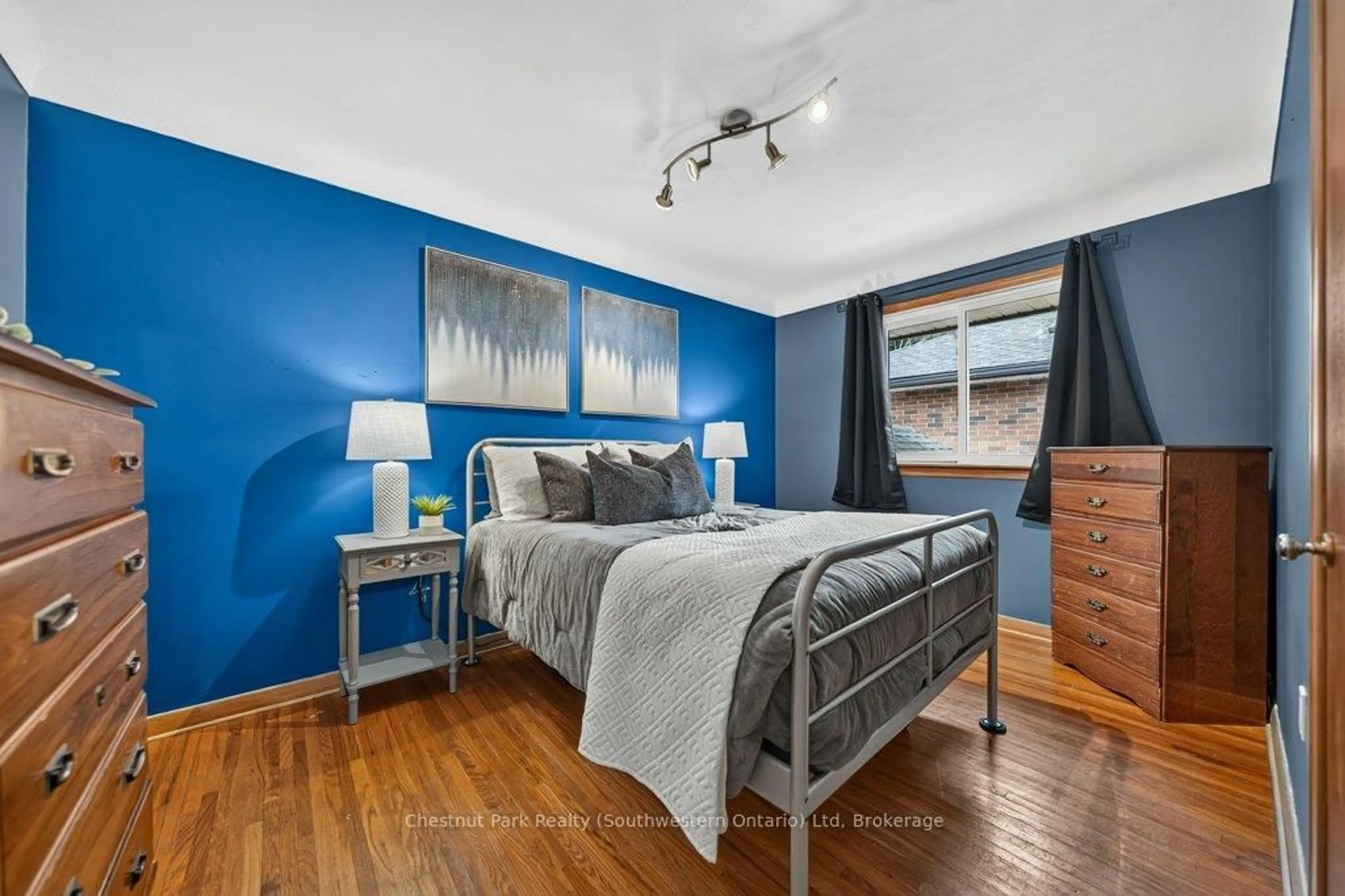Bedroom with bed, wood/laminate floor for 39 Cedar St, Guelph Ontario N1G 1B9