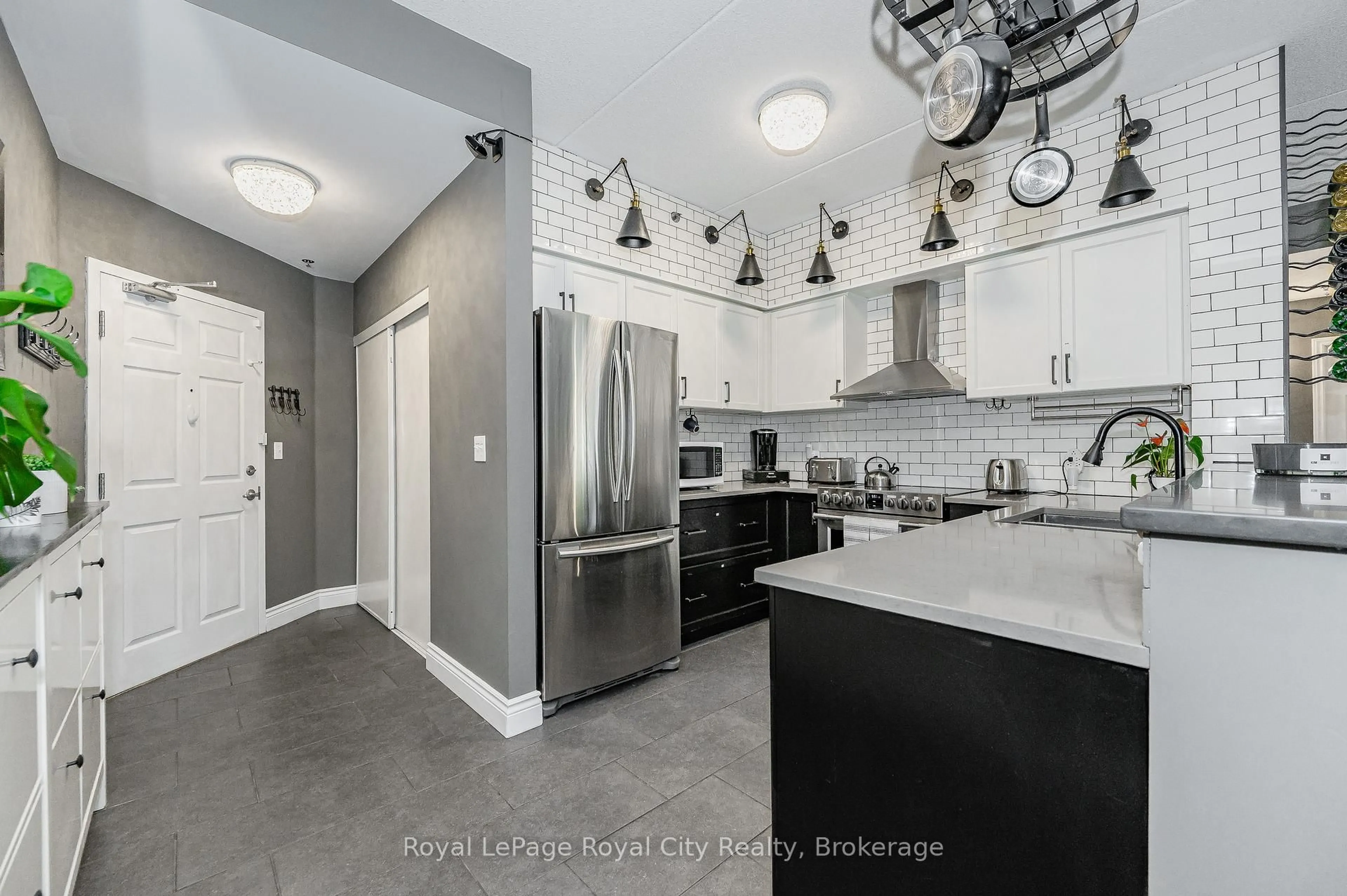 Open concept kitchen, ceramic/tile floor for 308 Watson Pkwy #102, Guelph Ontario N1E 0G7