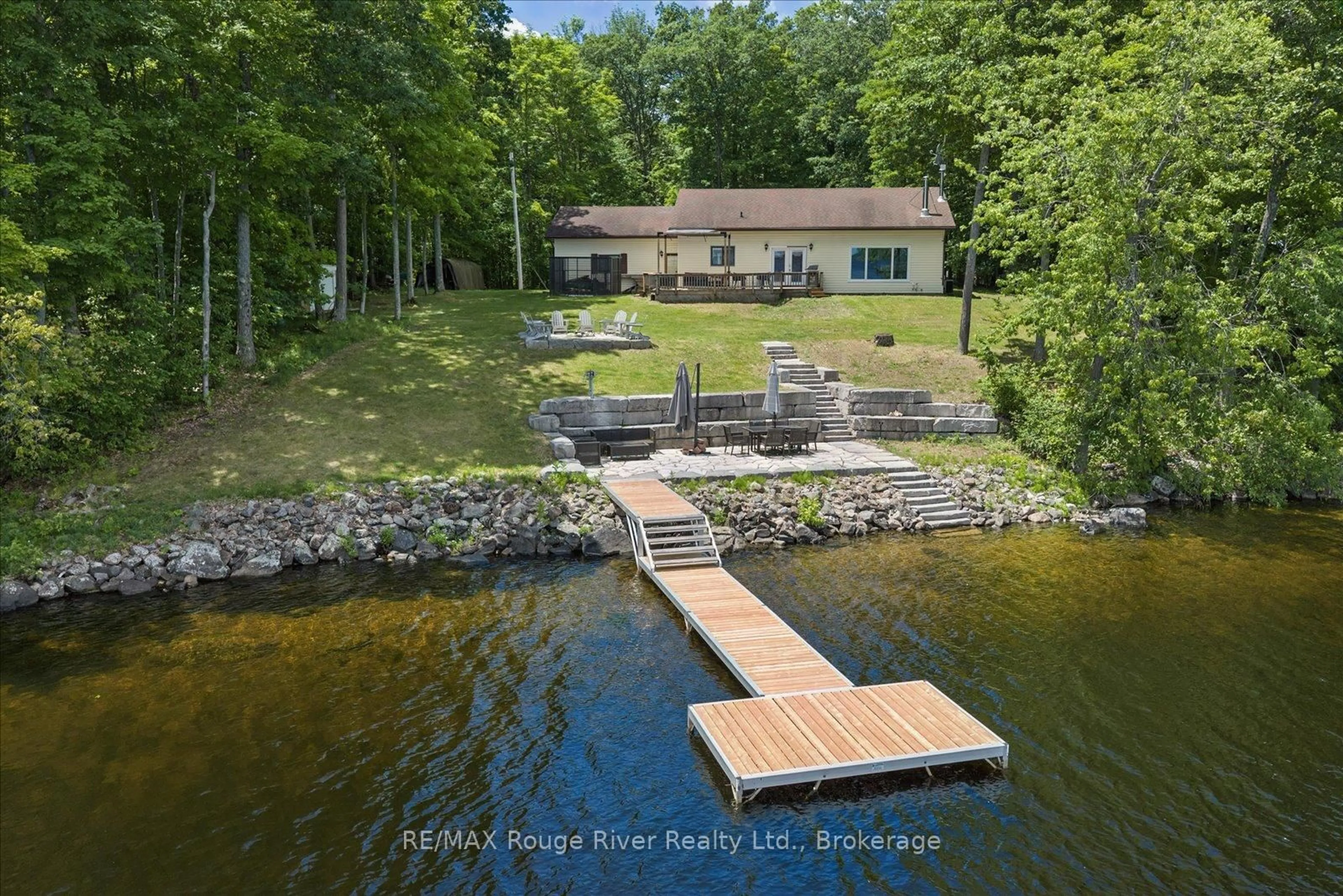 A pic from outside/outdoor area/front of a property/back of a property/a pic from drone, water/lake/river/ocean view for 79 Big Island Rd, Limoges Ontario K0K 2M0