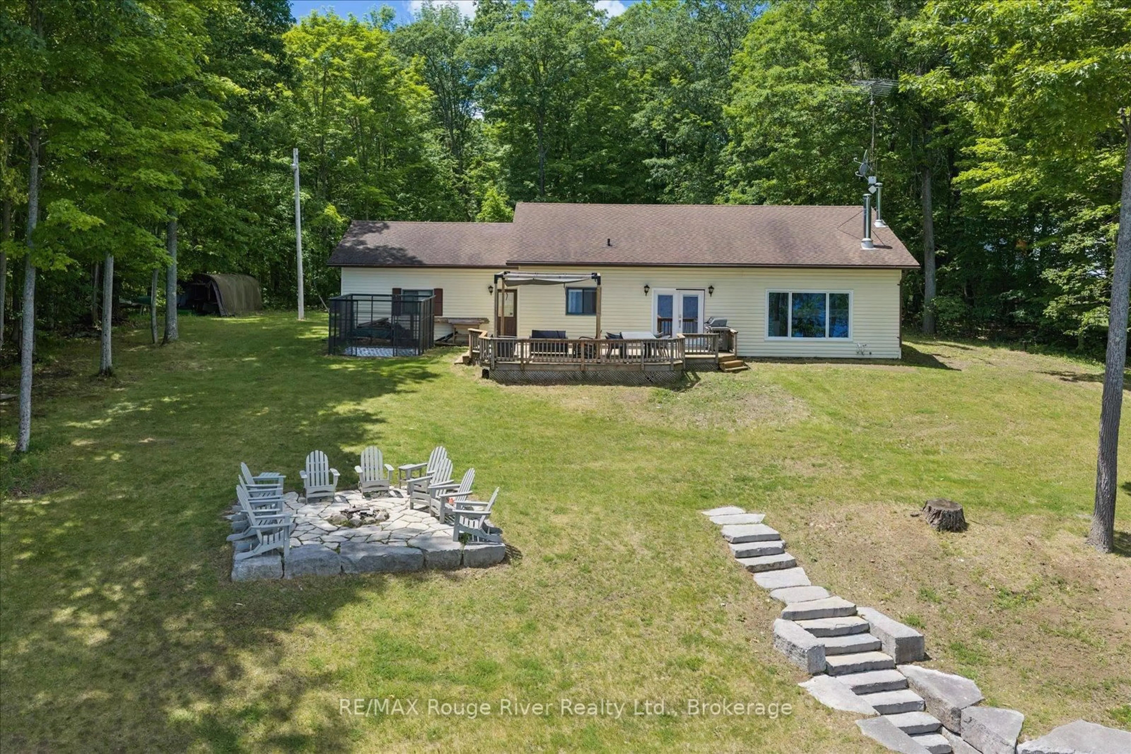 A pic from outside/outdoor area/front of a property/back of a property/a pic from drone, water/lake/river/ocean view for 79 Big Island Rd, Limoges Ontario K0K 2M0