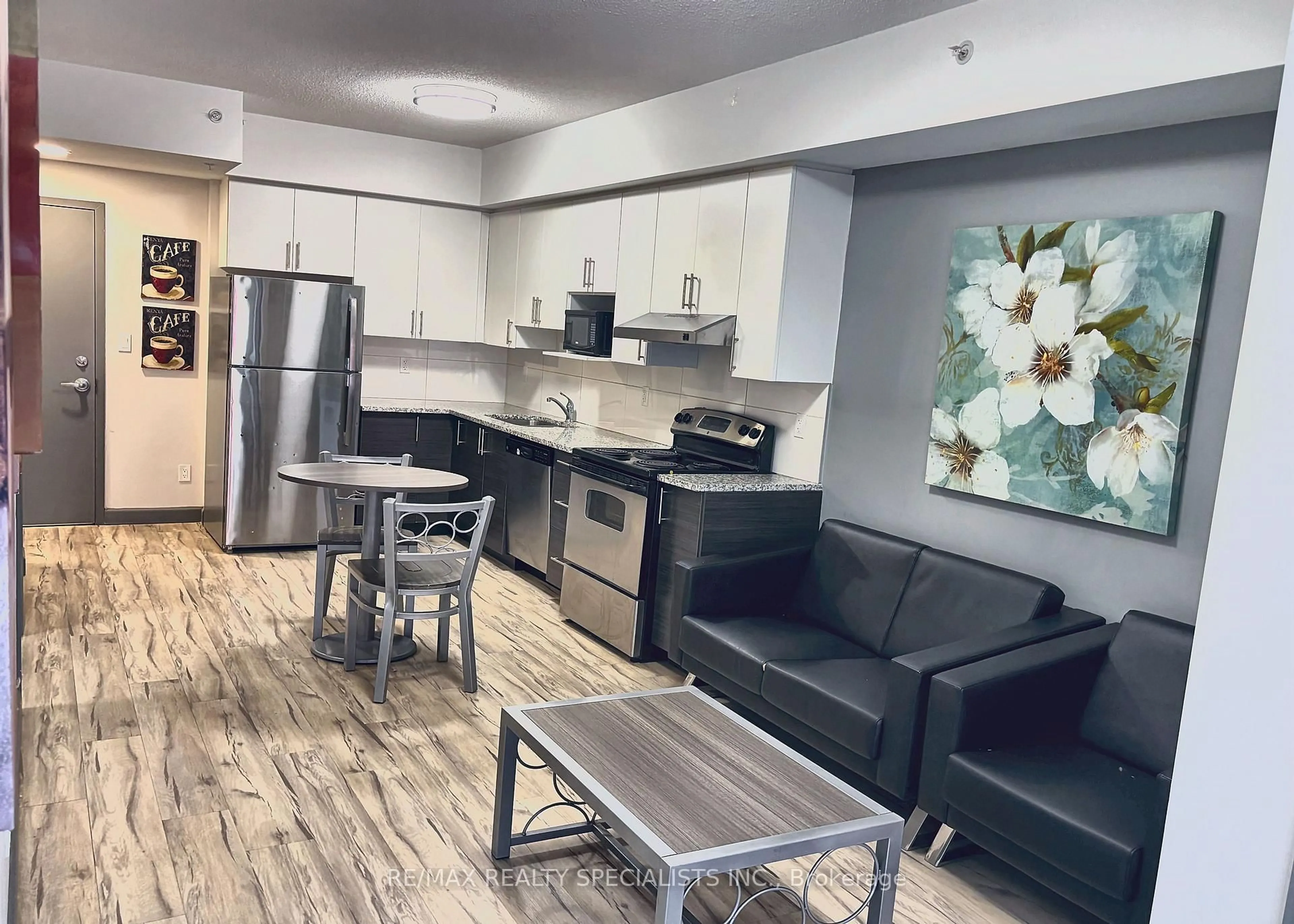 Open concept kitchen, wood/laminate floor for 258C Sunview St #332, Waterloo Ontario N2L 0H8