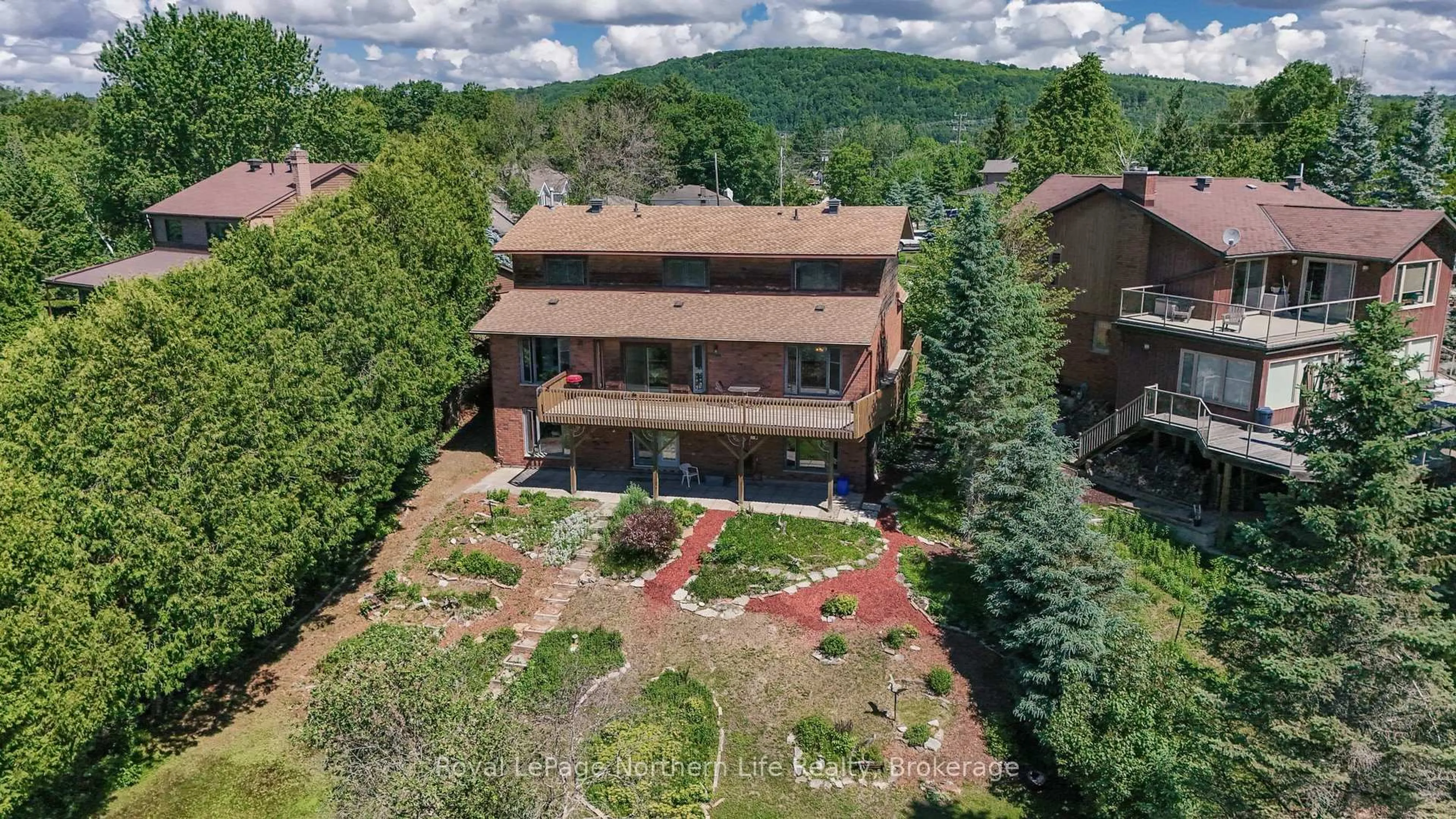 A pic from outside/outdoor area/front of a property/back of a property/a pic from drone, mountain view for 8 Found Crt, North Bay Ontario P1A 4E5