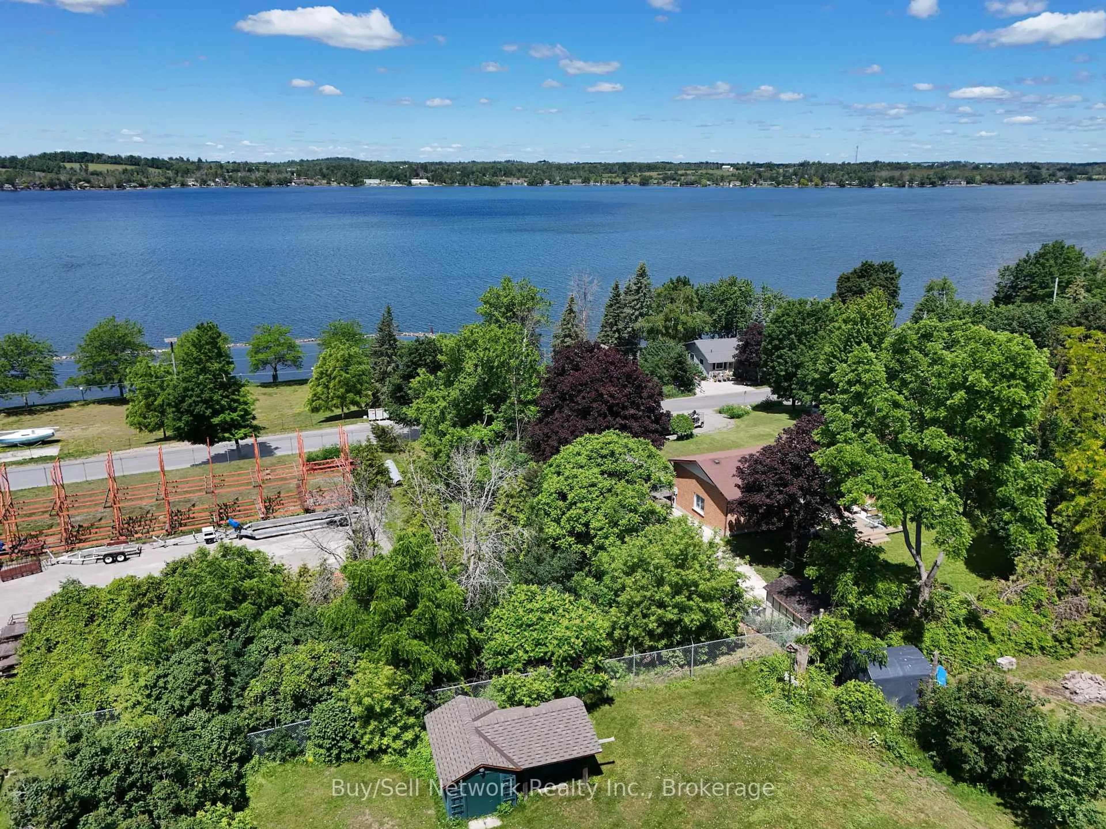 A pic from outside/outdoor area/front of a property/back of a property/a pic from drone, water/lake/river/ocean view for 962 Ward St, Selwyn Ontario K0L 1H0