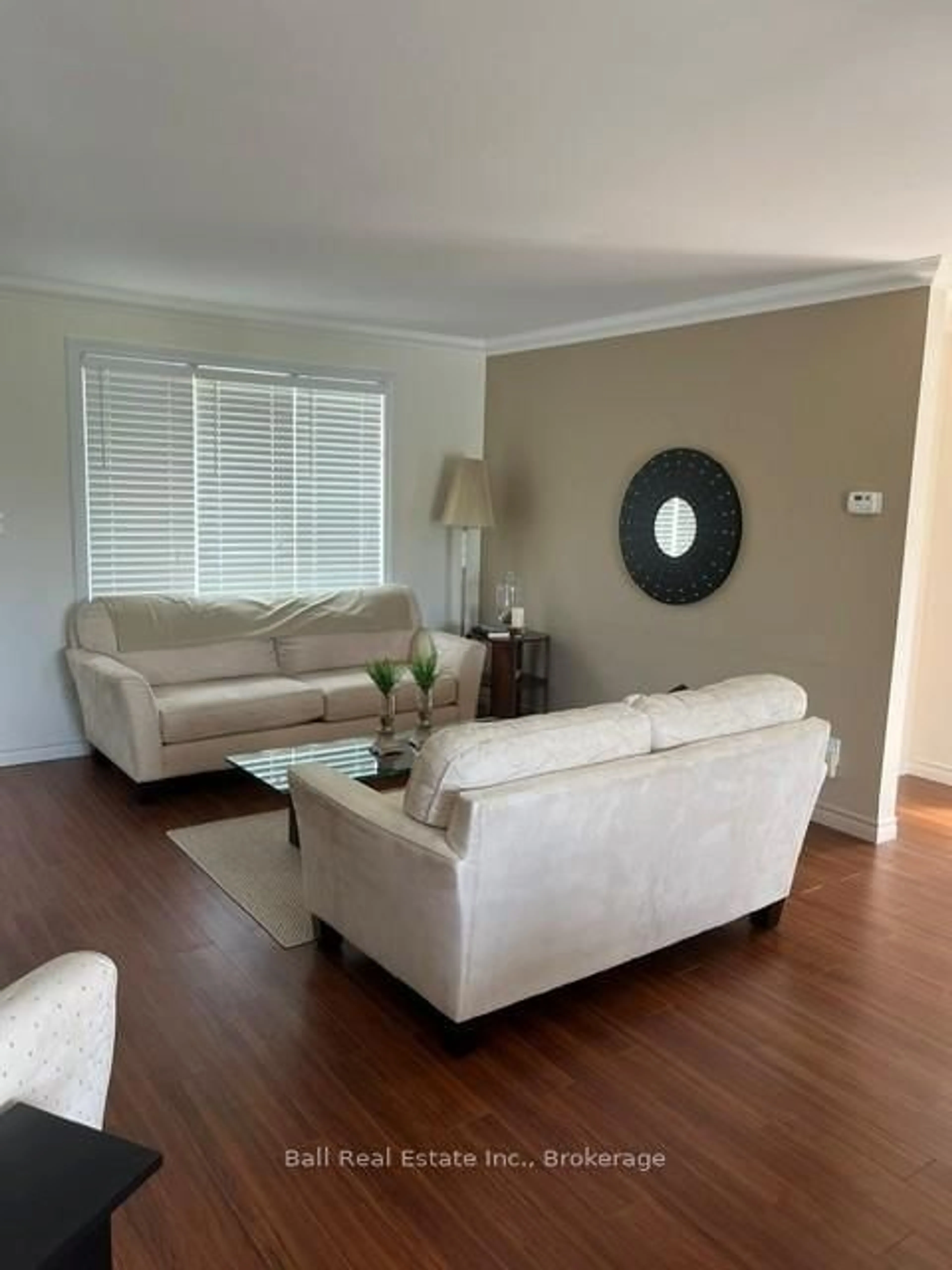 Living room with furniture, wood/laminate floor for 77 Water St, Trent Hills Ontario K0L 1Y0