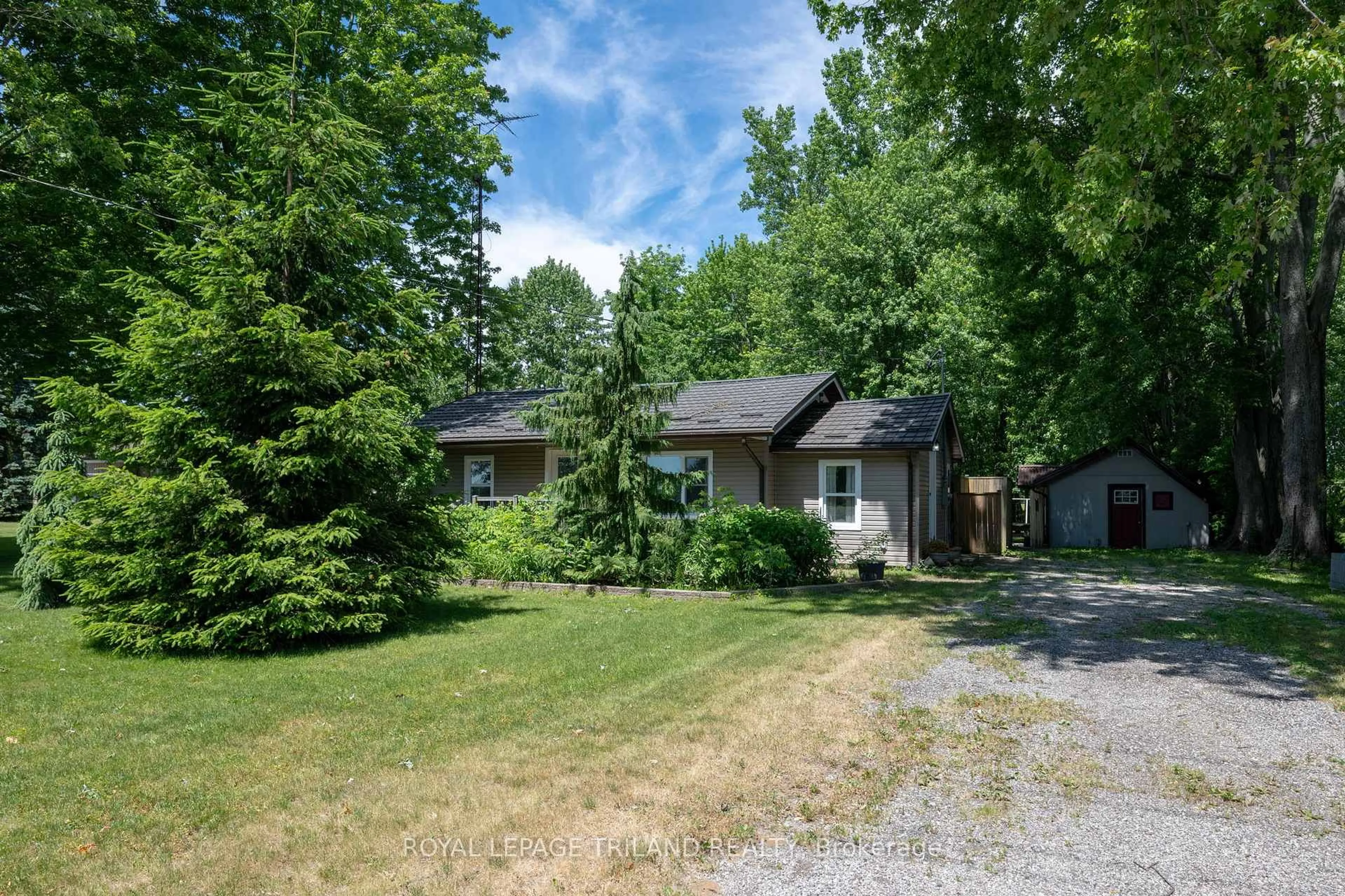 A pic from outside/outdoor area/front of a property/back of a property/a pic from drone, unknown for 22516 Pioneer Line, West Elgin Ontario N0L 2C0