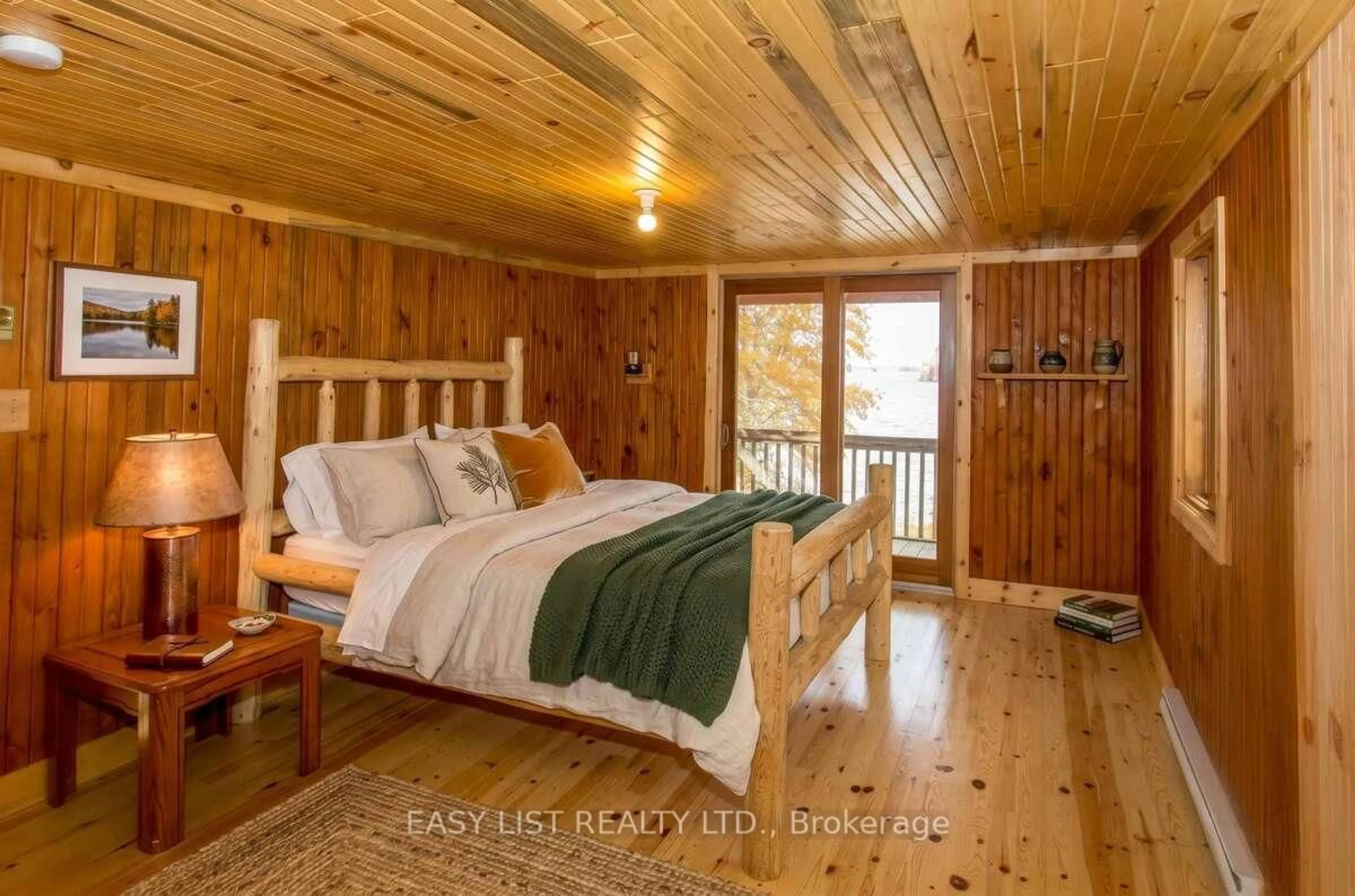 Bedroom with bed, wood/laminate floor for Island WC3-1, West Nipissing Ontario P0H 1R0