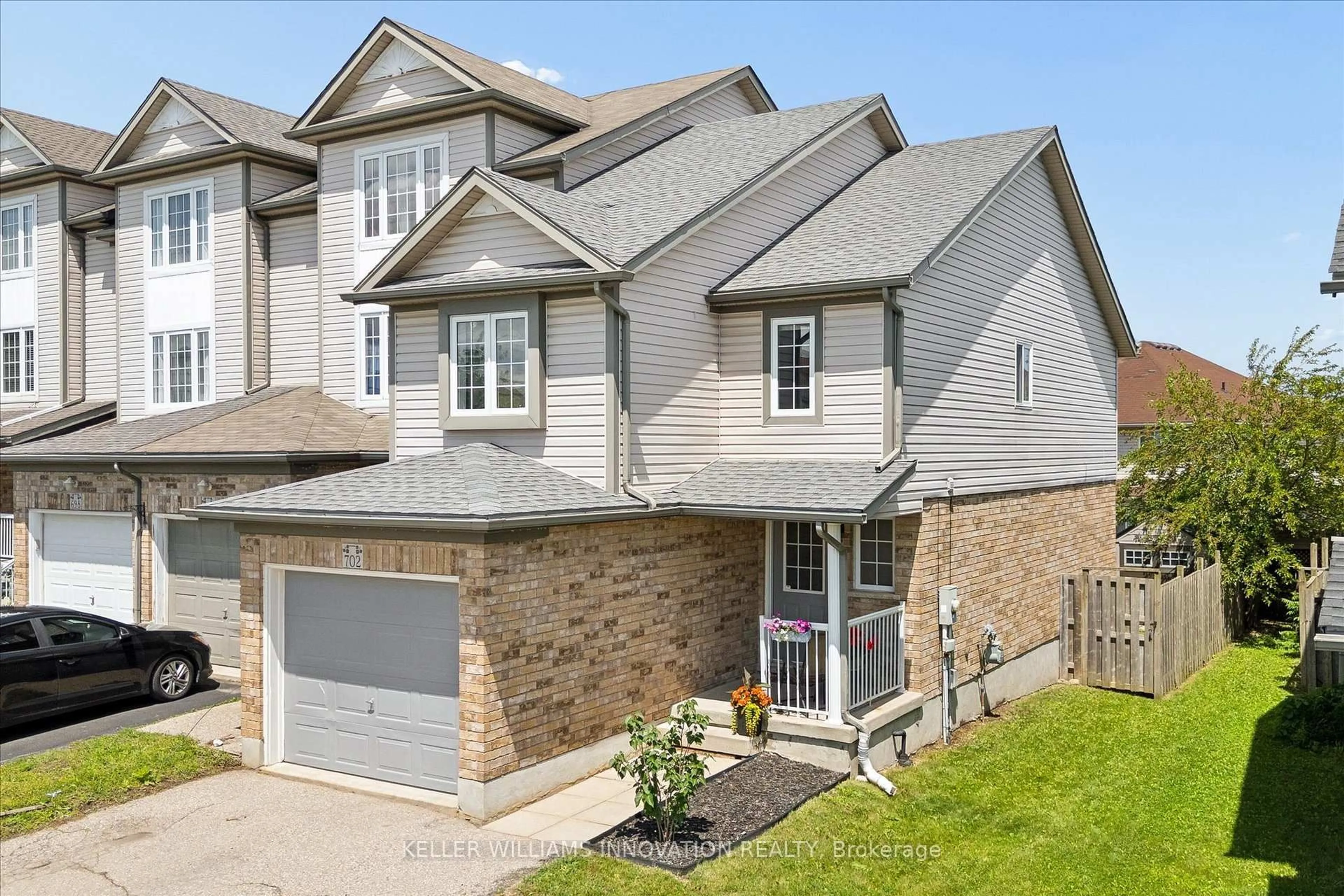 Home with brick exterior material, street for 702 Activa Ave, Kitchener Ontario N2E 4E1