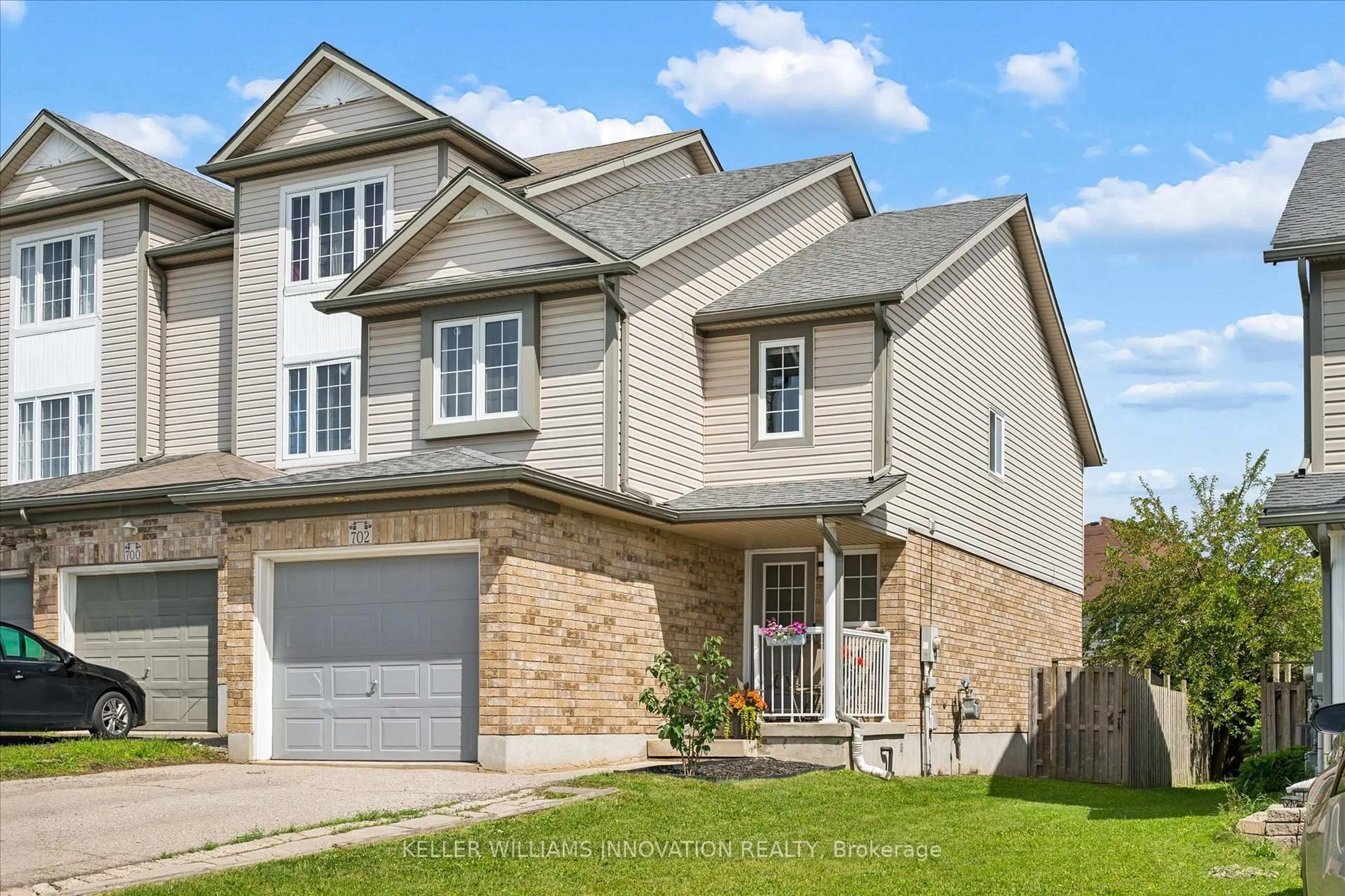 Home with brick exterior material, street for 702 Activa Ave, Kitchener Ontario N2E 4E1