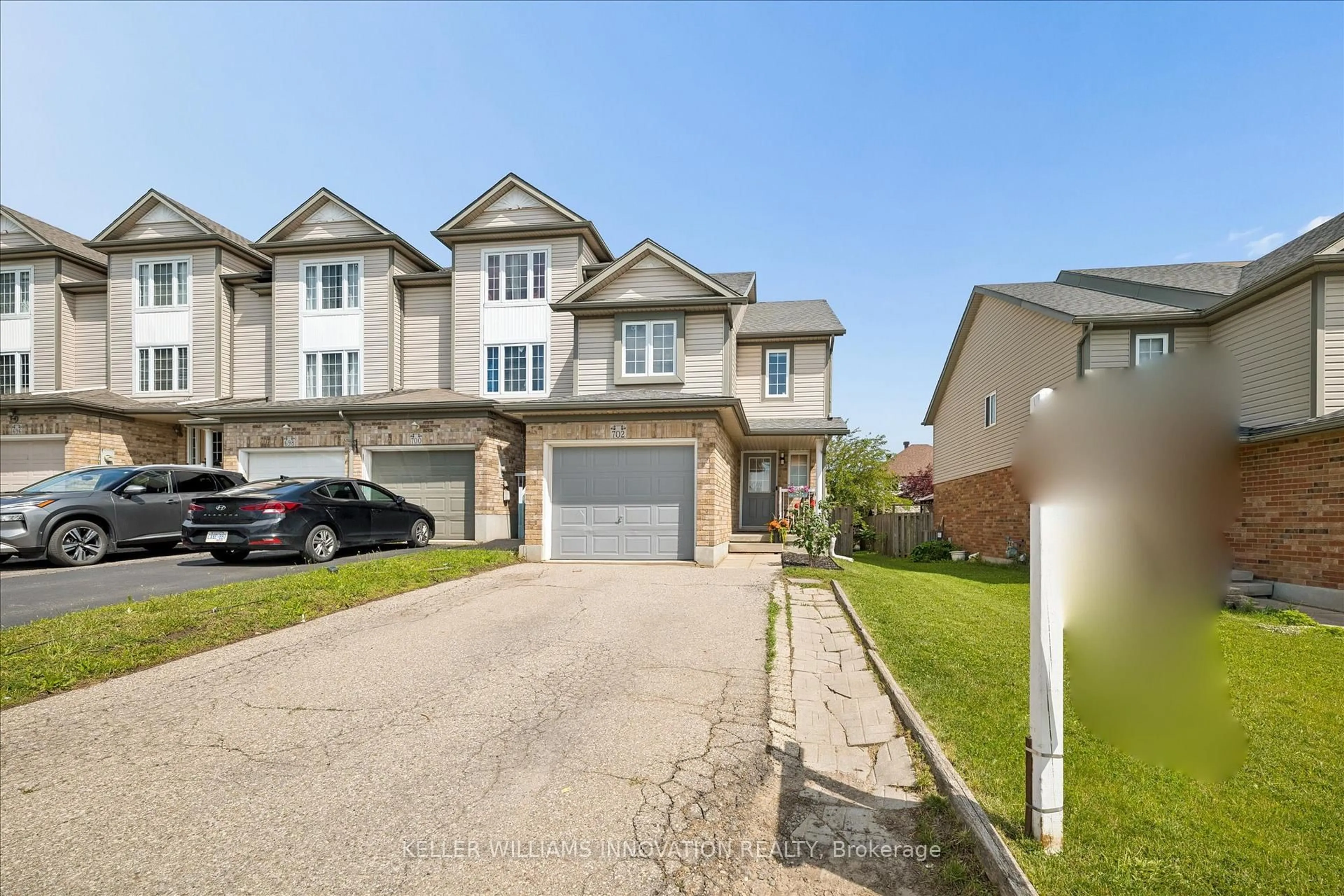 A pic from outside/outdoor area/front of a property/back of a property/a pic from drone, street for 702 Activa Ave, Kitchener Ontario N2E 4E1