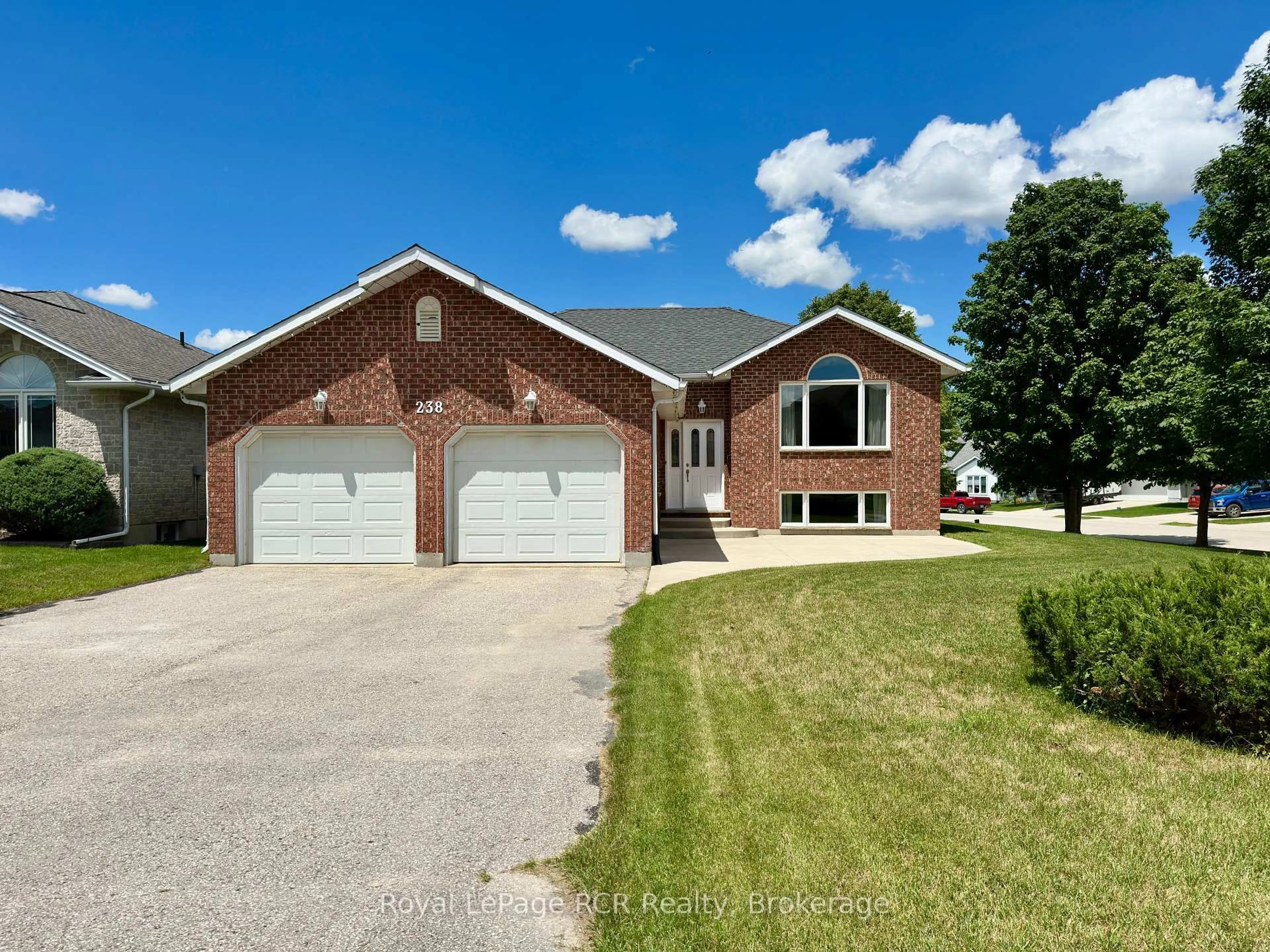 Home with brick exterior material, street for 238 4th Street Cres, Hanover Ontario N4N 3S2