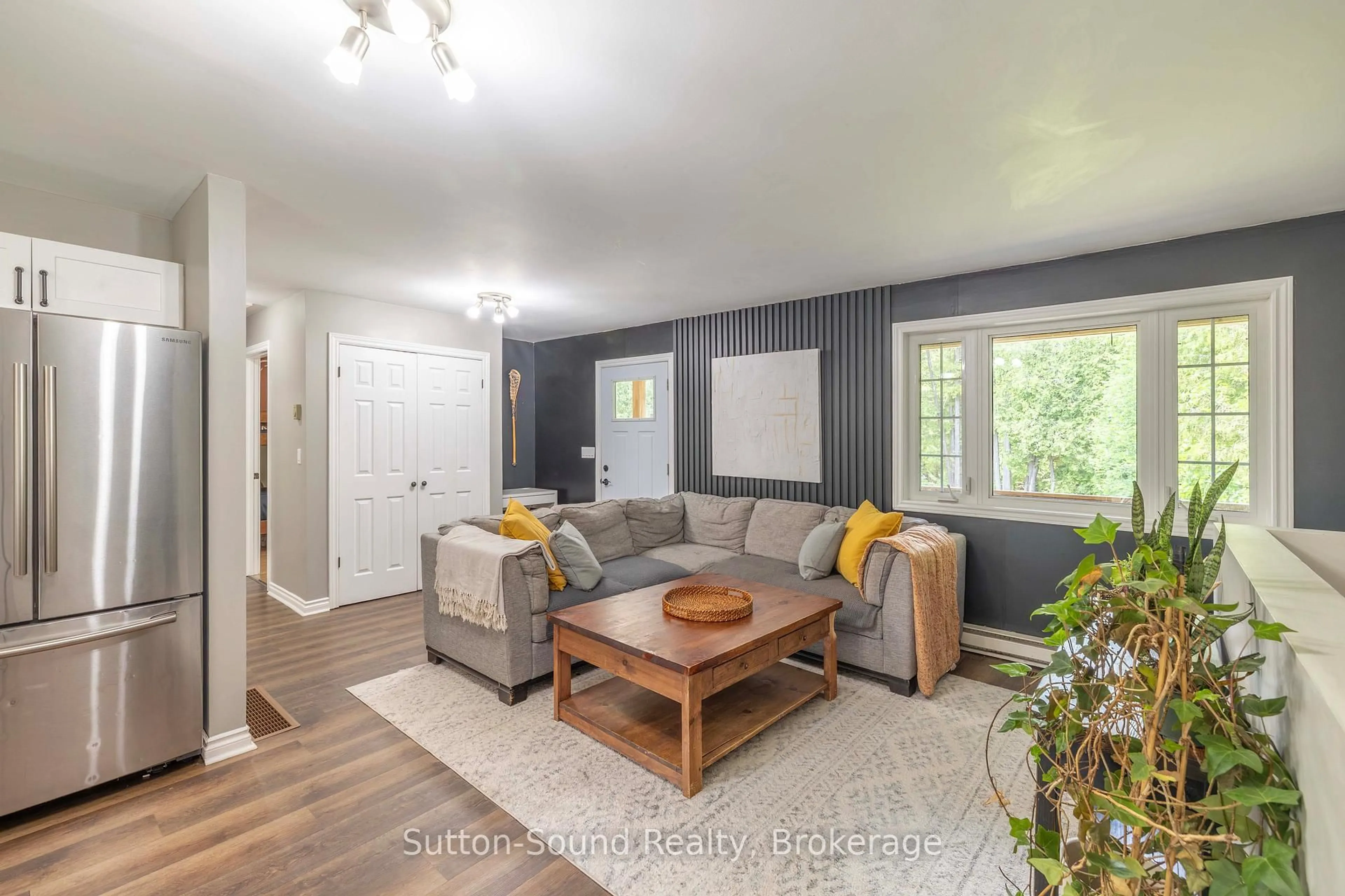 Living room with furniture, wood/laminate floor for 395685 Concession 2 Concession, Chatsworth Ontario N0H 2V0