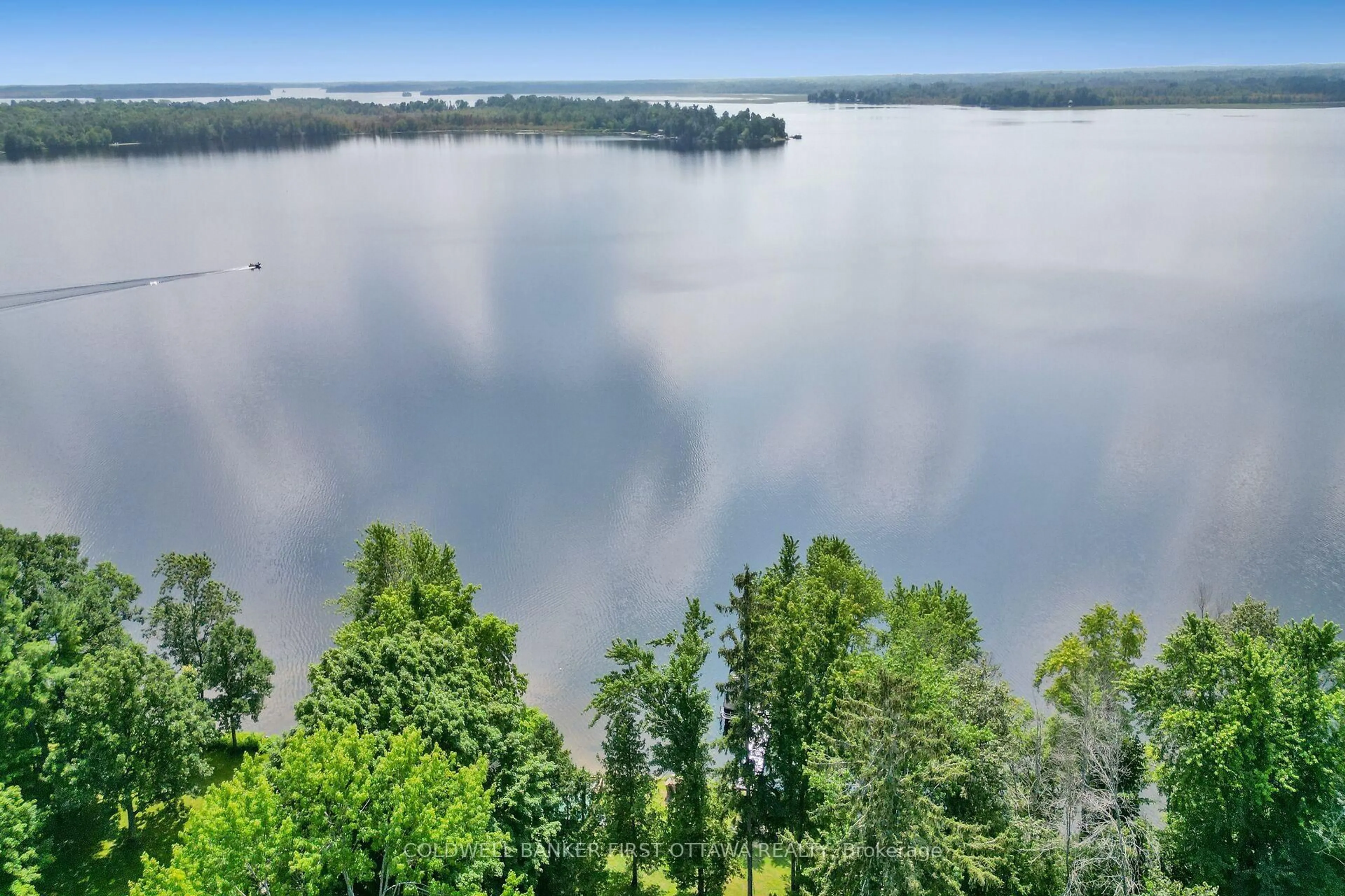 A pic from outside/outdoor area/front of a property/back of a property/a pic from drone, water/lake/river/ocean view for 100 Loch End Rd, Beckwith Ontario K7C 0S9